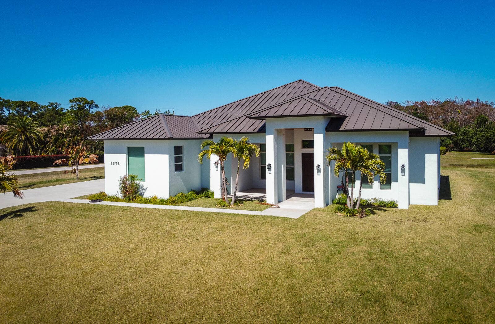 7595 155th Place N, Palm Beach Gardens, FL 33418 01-Front Exterior