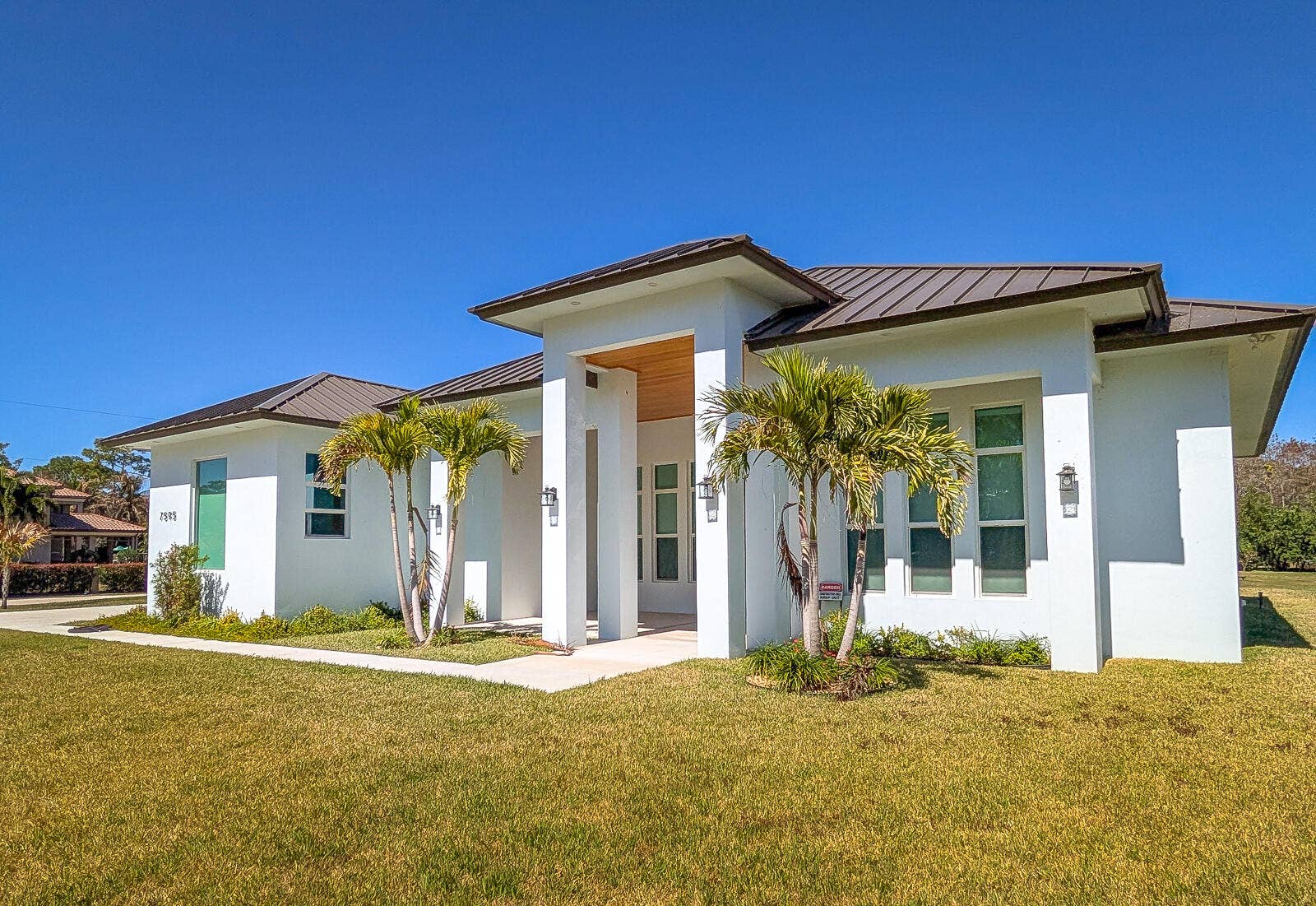 7595 155th Place N, Palm Beach Gardens, FL 33418 07-Front Exterior