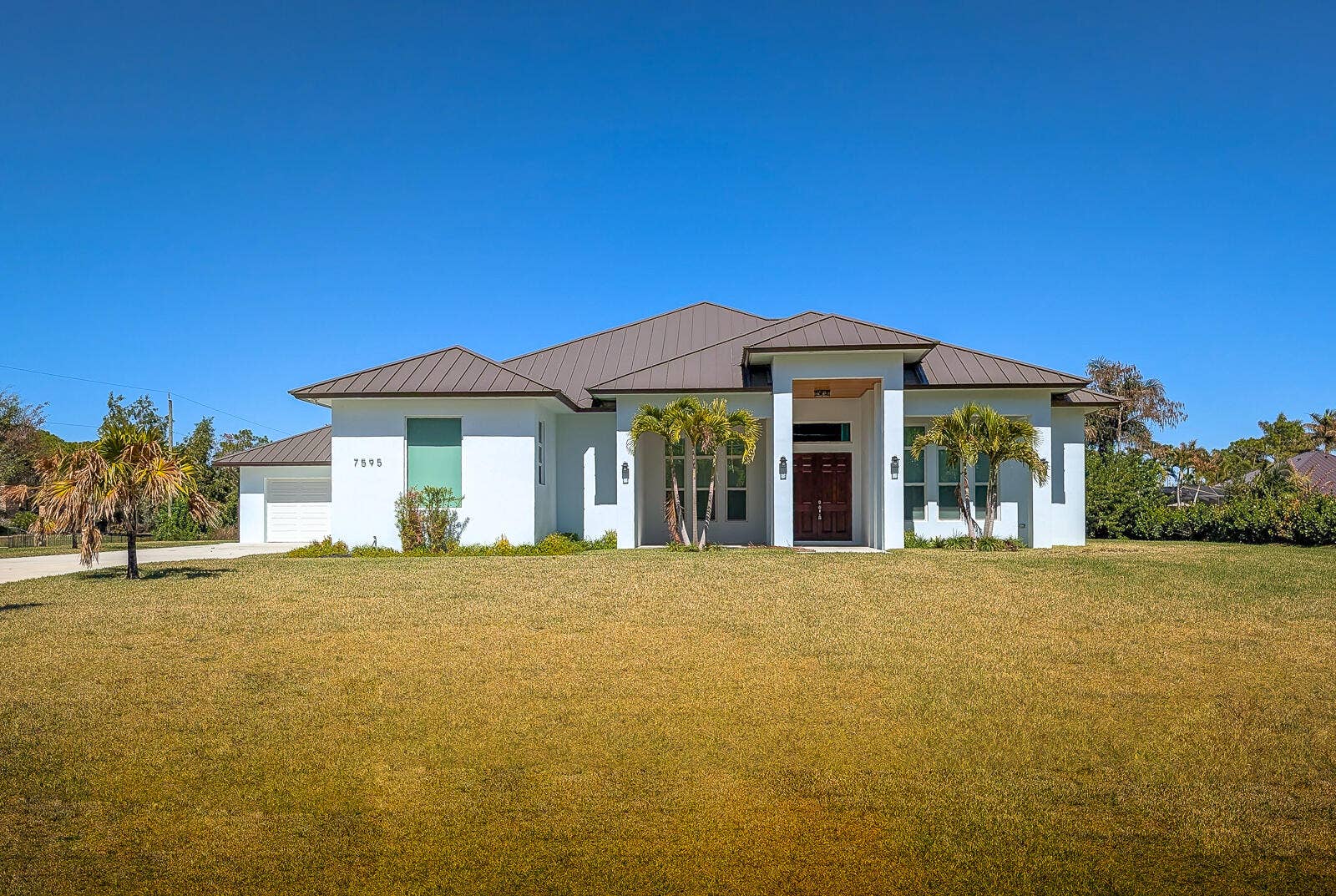 7595 155th Place N, Palm Beach Gardens, FL 33418 49-Front Exterior