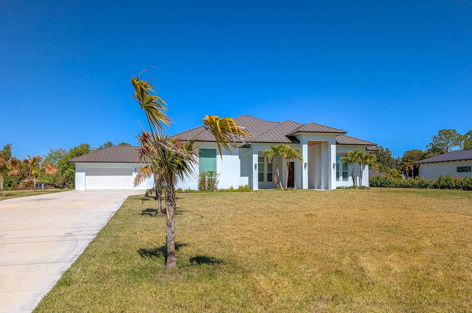 7595 155th Place N, Palm Beach Gardens, FL 33418 55-Front Exterior
