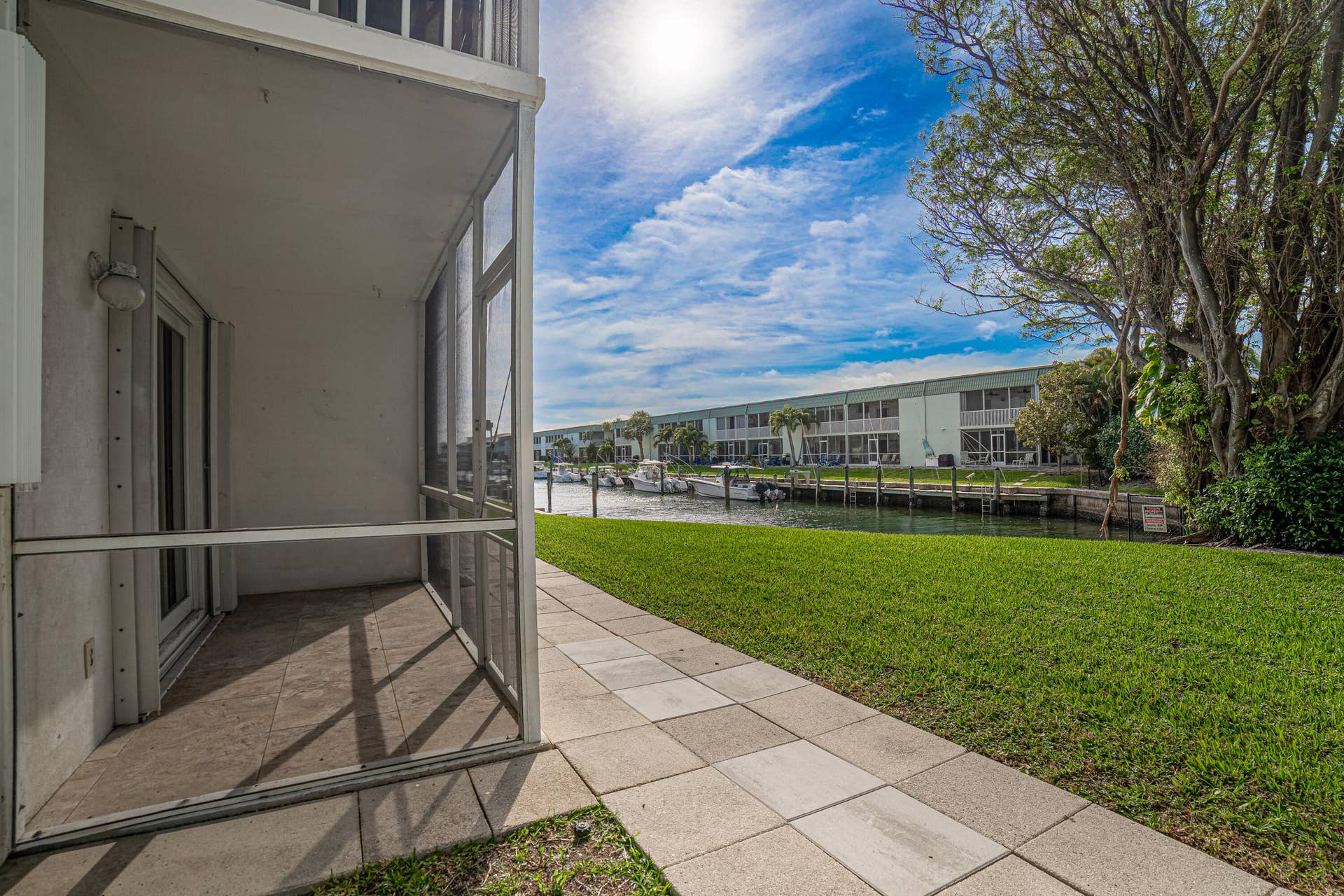130 Doolen Court, #108, North Palm Beach, FL 33408 Back of Building w/Canal View