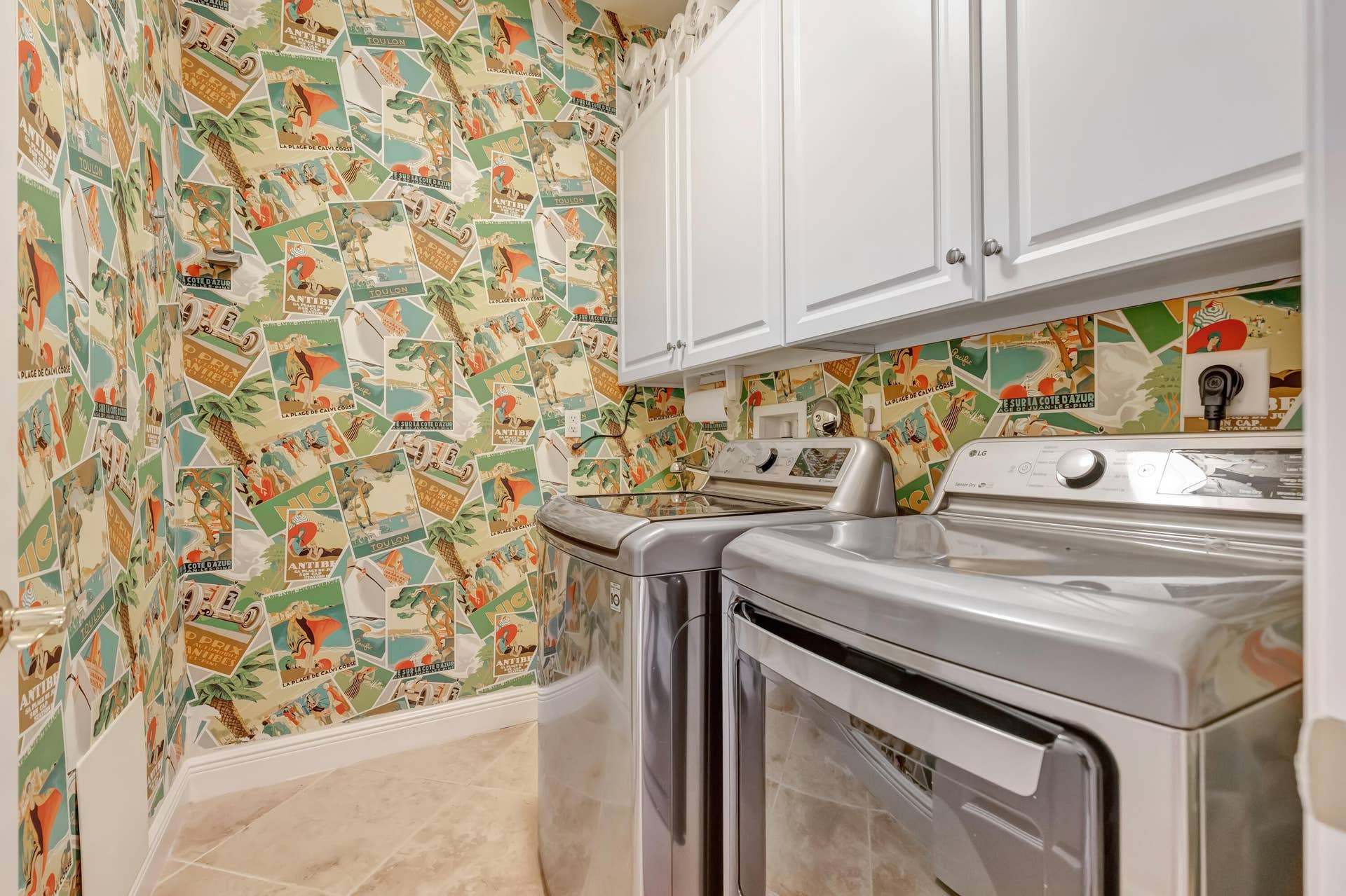104 Renaissance Drive, North Palm Beach, FL 33410 laundry with around the work wallpaper extra large washer and dryer