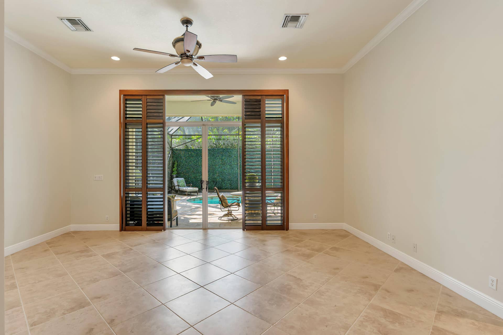 104 Renaissance Drive, North Palm Beach, FL 33410 Living room looking toward pool
