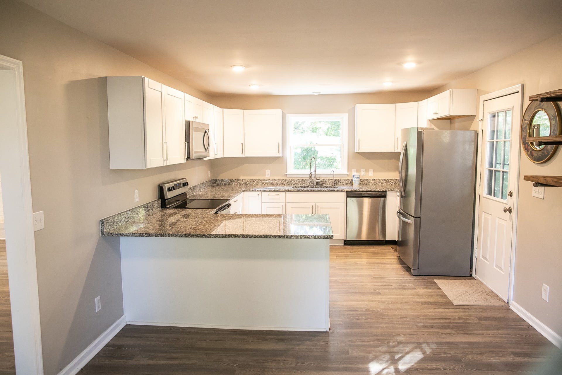Kitchen and Exterior Door to Side Deck