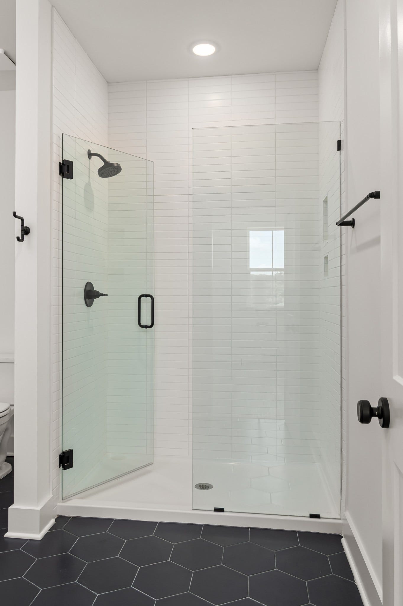 3310 Conviser Dr, Nashville, TN 37207 Step into luxury with this large owner's walk-in shower, designed to elevate your daily routine.