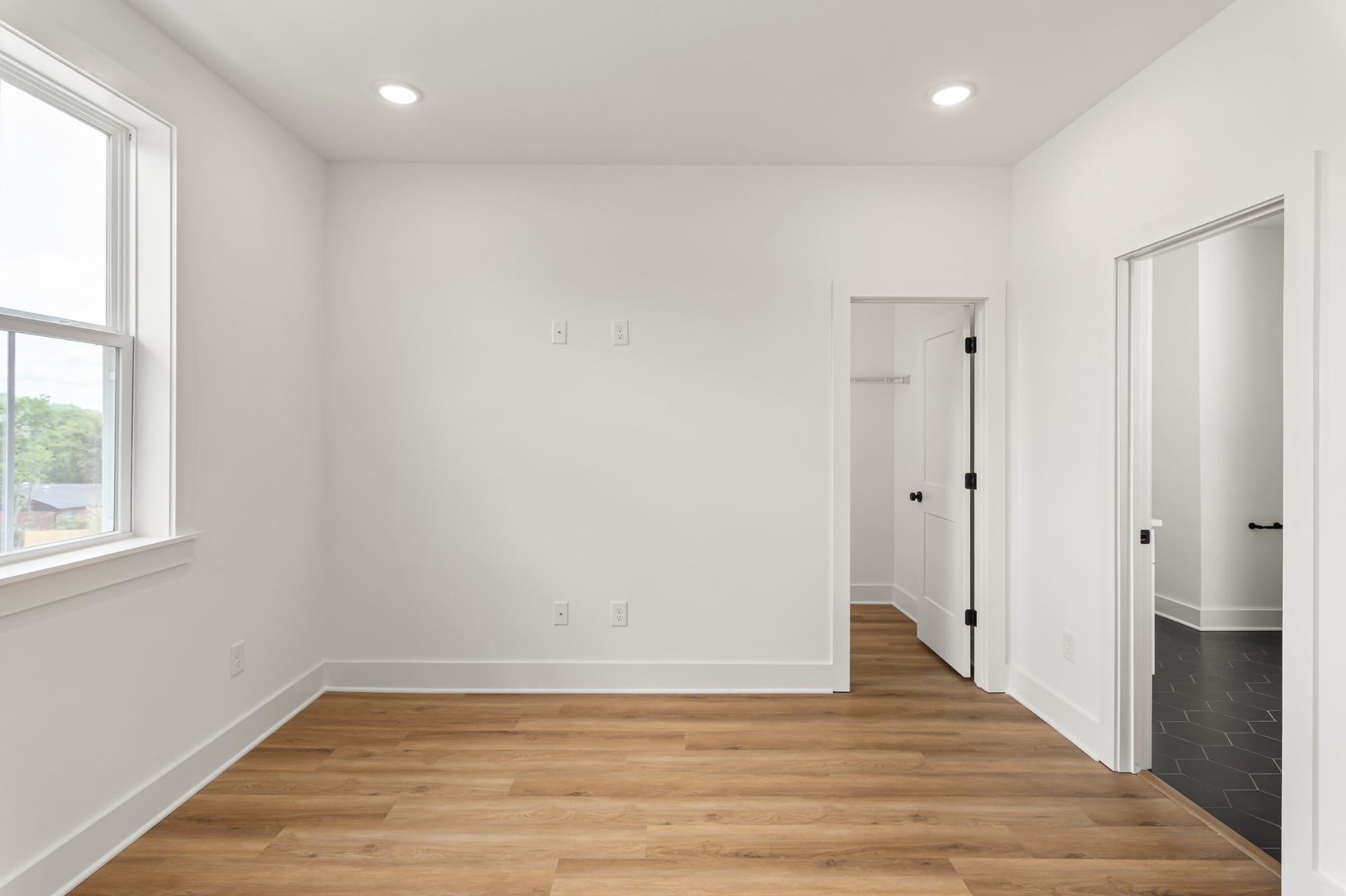 3310 Conviser Dr, Nashville, TN 37207 Step into the expansive owners bedroom, where luxury meets comfort. This generous space offers a serene retreat, complete with large windows that flood the room with natural light and provide stunning views.