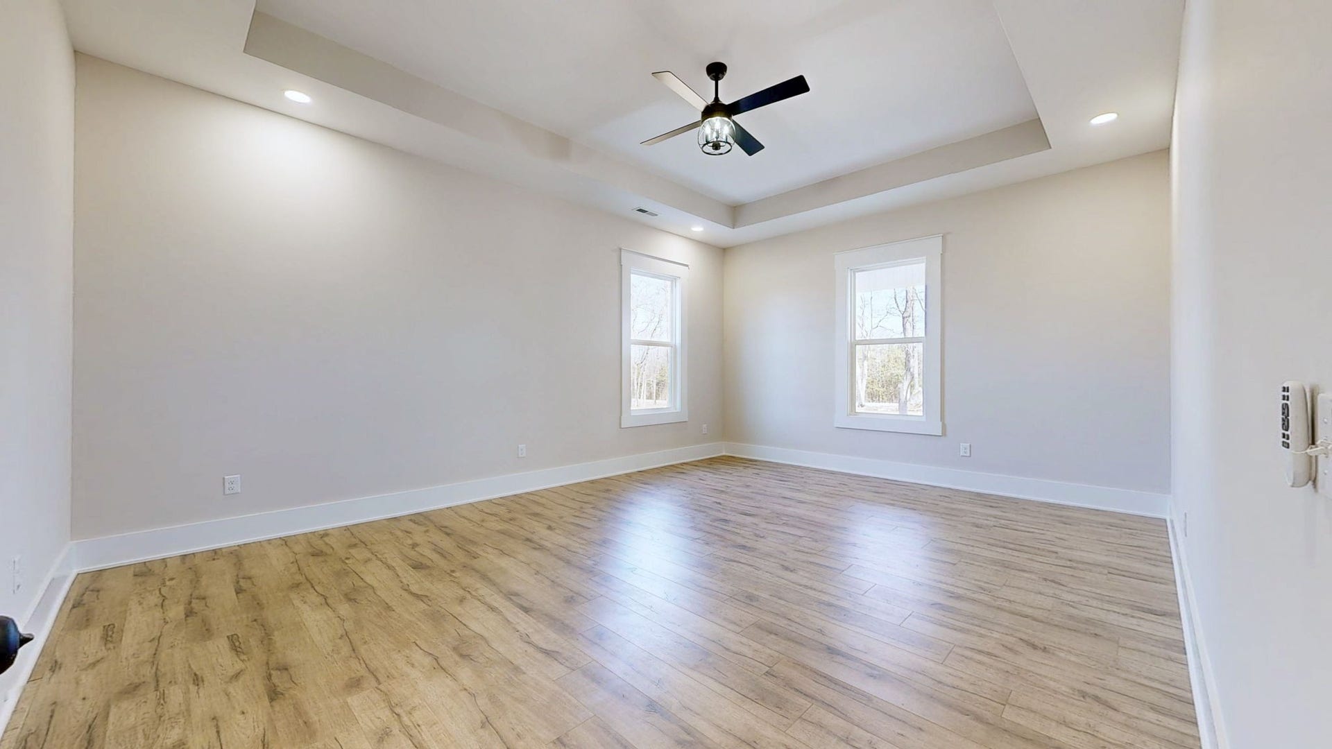 579 Lower Halls Mill Rd, Shelbyville, TN 37160 The large primary bedroom features a tray ceiling with recessed lighting and a beautiful light/fan combination.