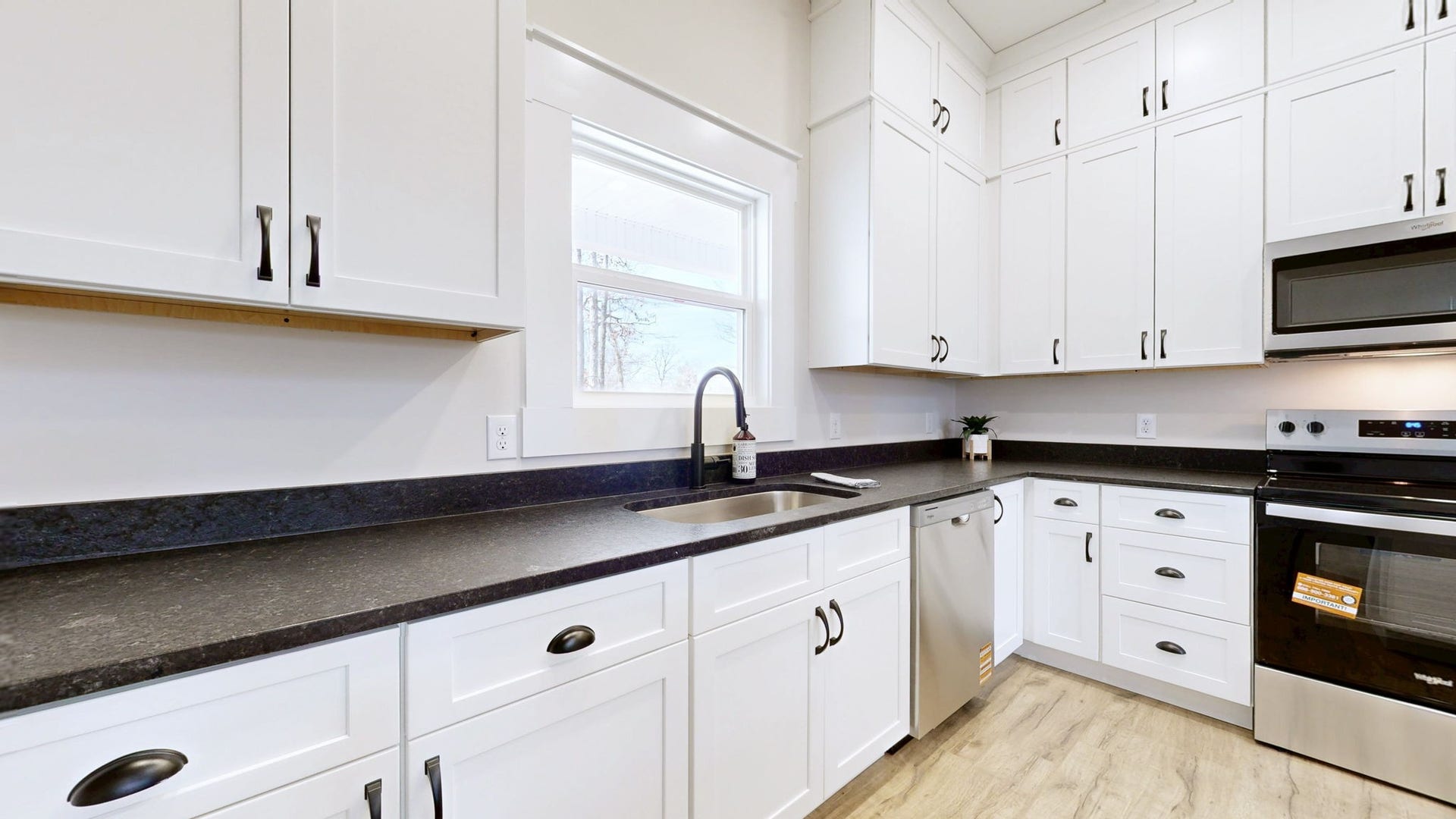 579 Lower Halls Mill Rd, Shelbyville, TN 37160 Stainless appliances and deep farm sink.