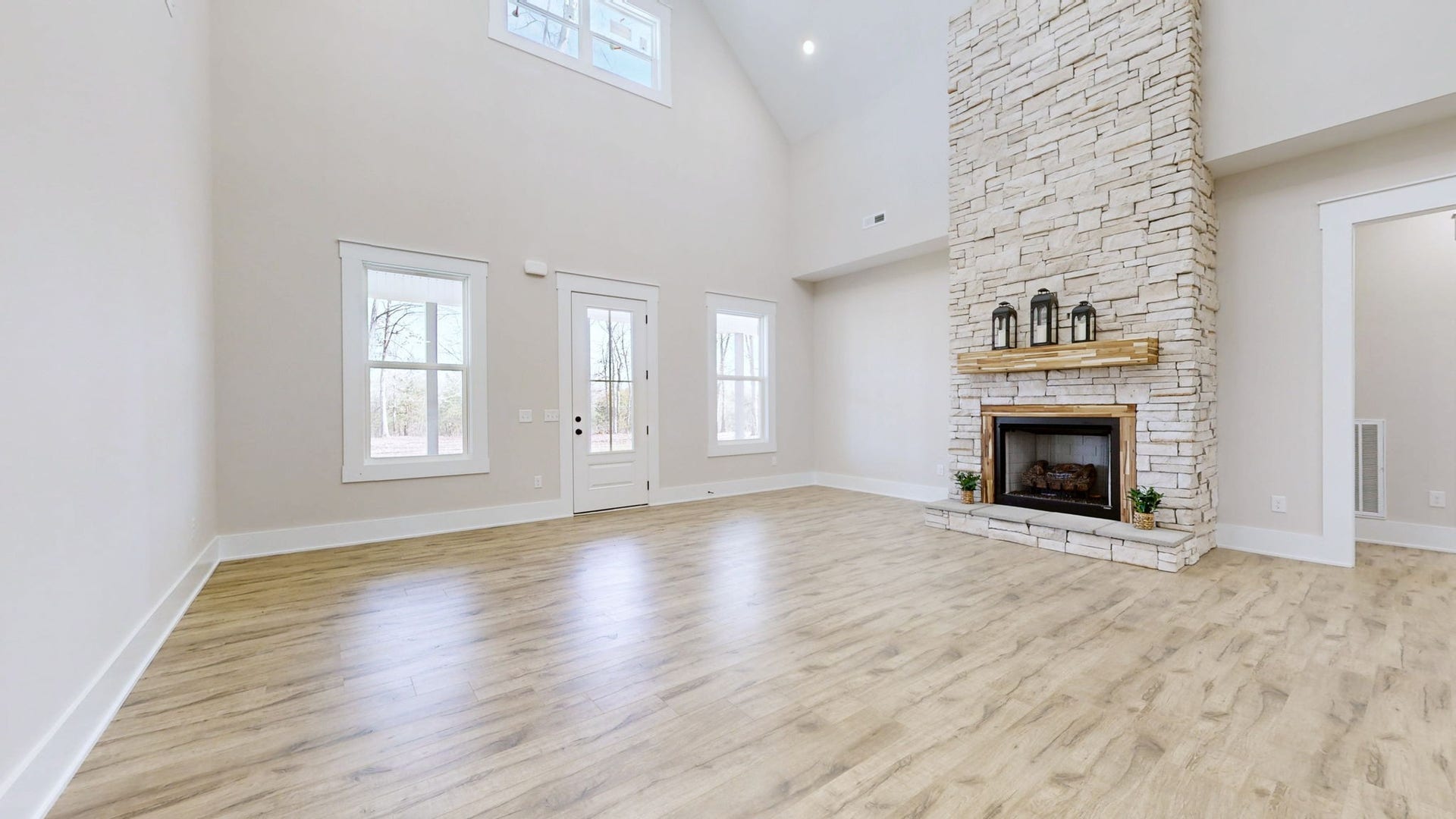 579 Lower Halls Mill Rd, Shelbyville, TN 37160 The striking stone fireplace with gas logs, wood mantel, and wood surround is the focal point of the living area. Lots of natural lighting.