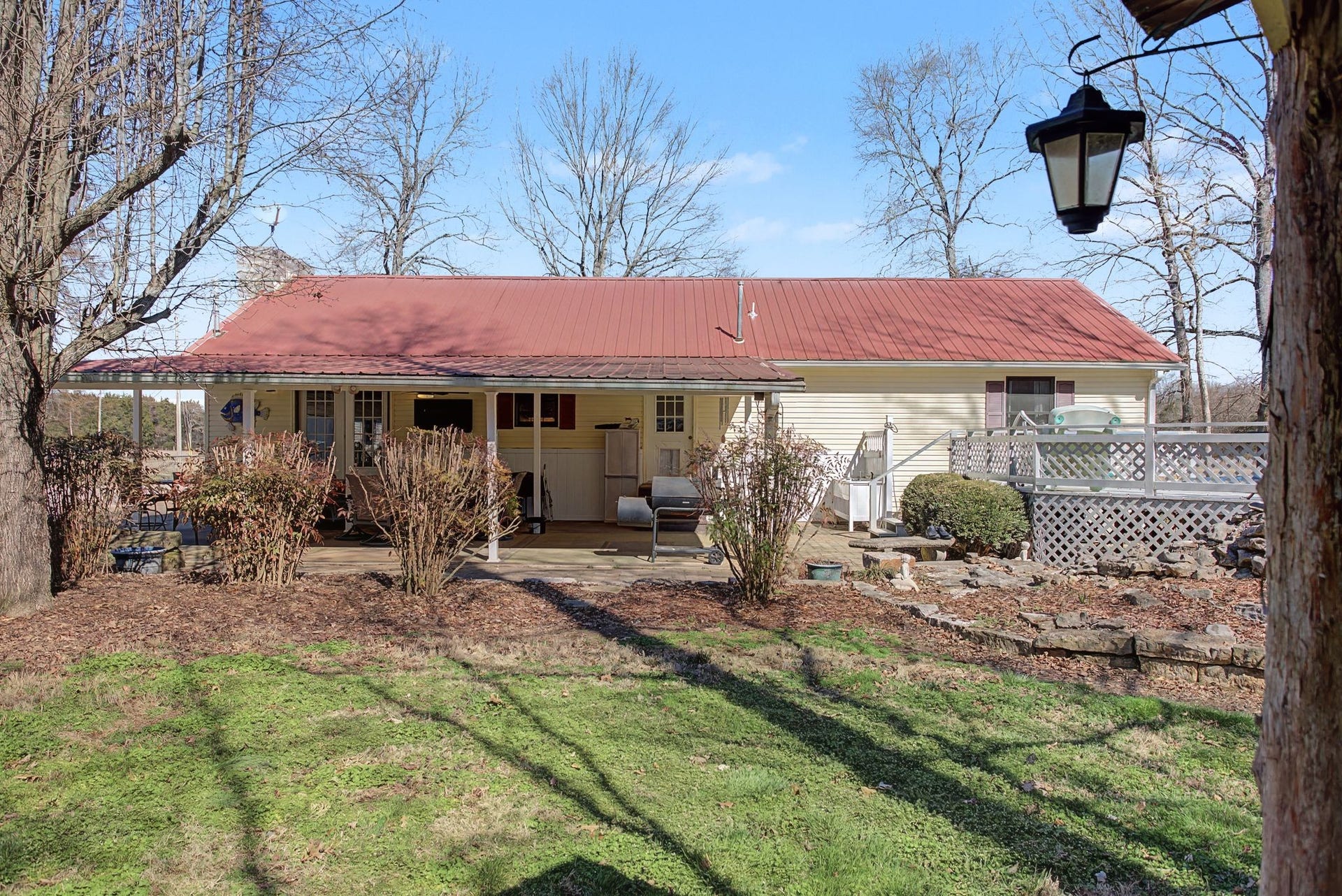 1545 Irwin Rd, Lewisburg, TN 37091 Back view of house Metal roof, with large covered patio