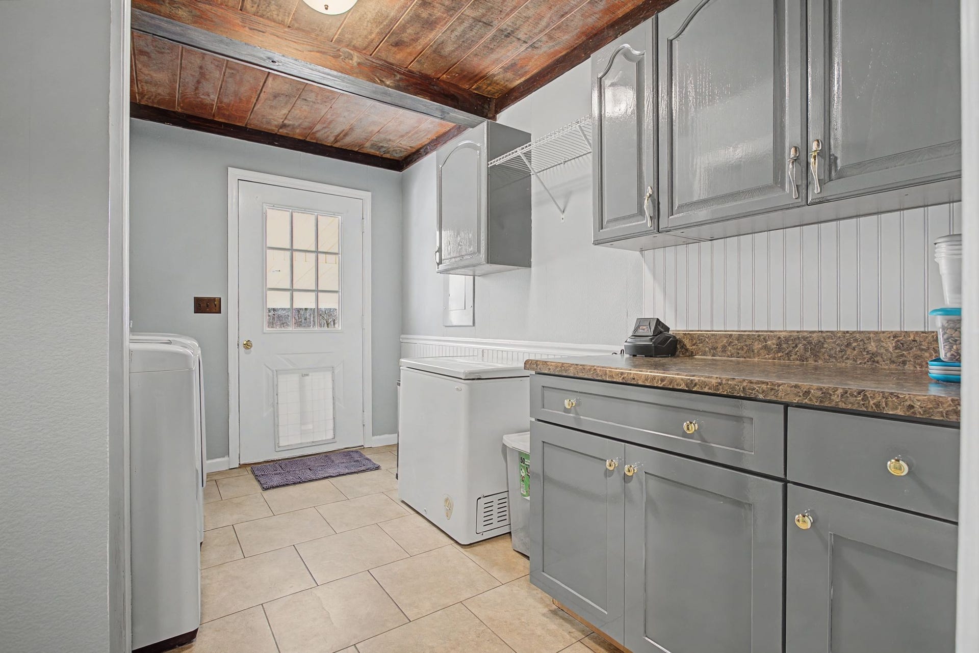 1545 Irwin Rd, Lewisburg, TN 37091 Walk-in Mud Room and laundry room with storage cabinets. Open shelving for extra pantry area and storage