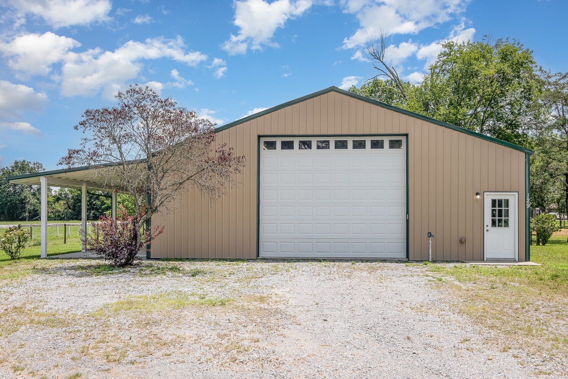 129 Highway 82 East, Bell Buckle, TN 37020 At 2,400 square feet total under roof and an additional huge covered porch, (pictured in the left side of this photo) this one has plenty of room for the outdoor toys as well!