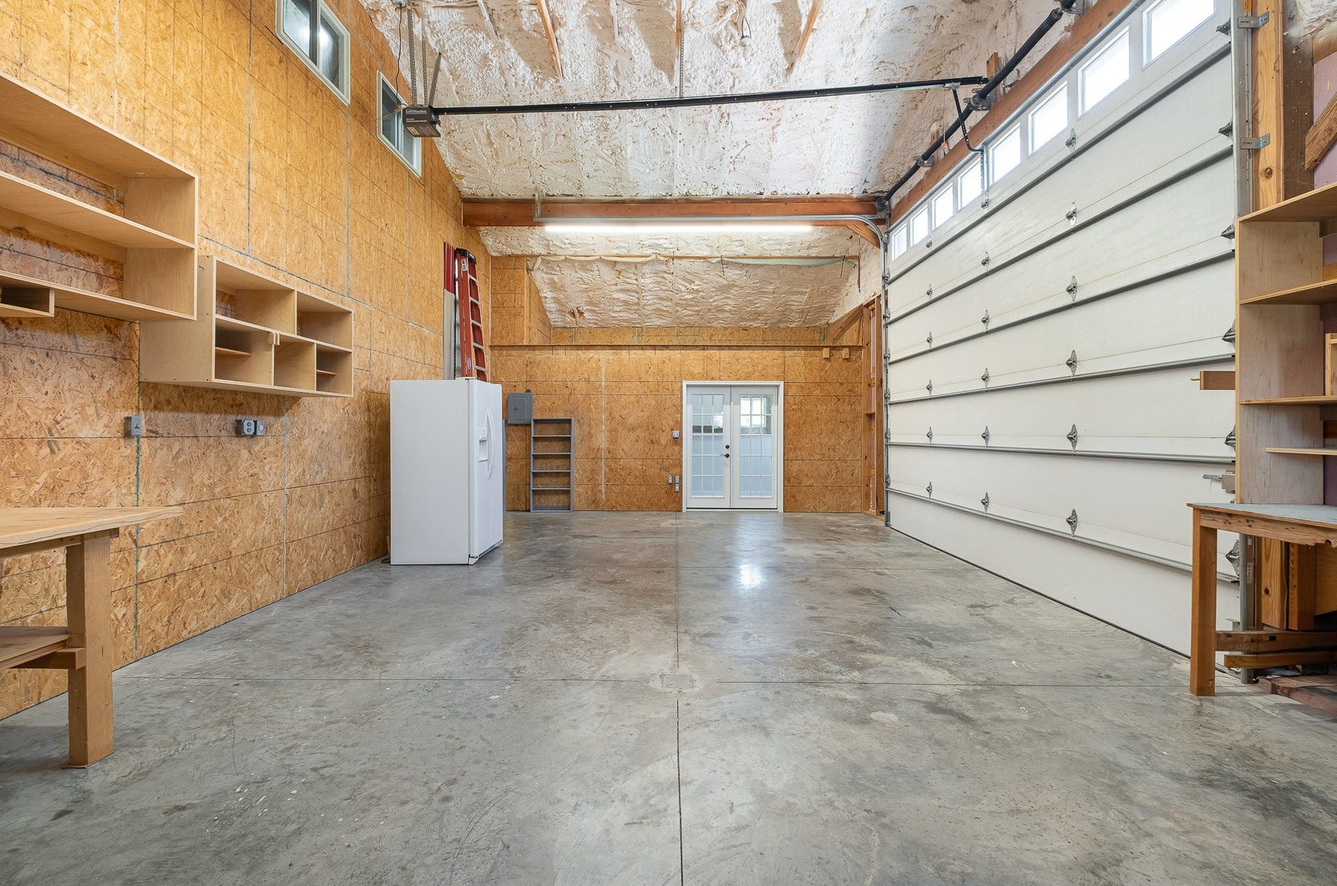 129 Highway 82 East, Bell Buckle, TN 37020 At just over 19' x 31', the attached garage / workshop offers plenty of space for parking vehicles, storage, or perhaps use as a hobby area. The garage door is 12' tall and will easily accommodate most vehicles.