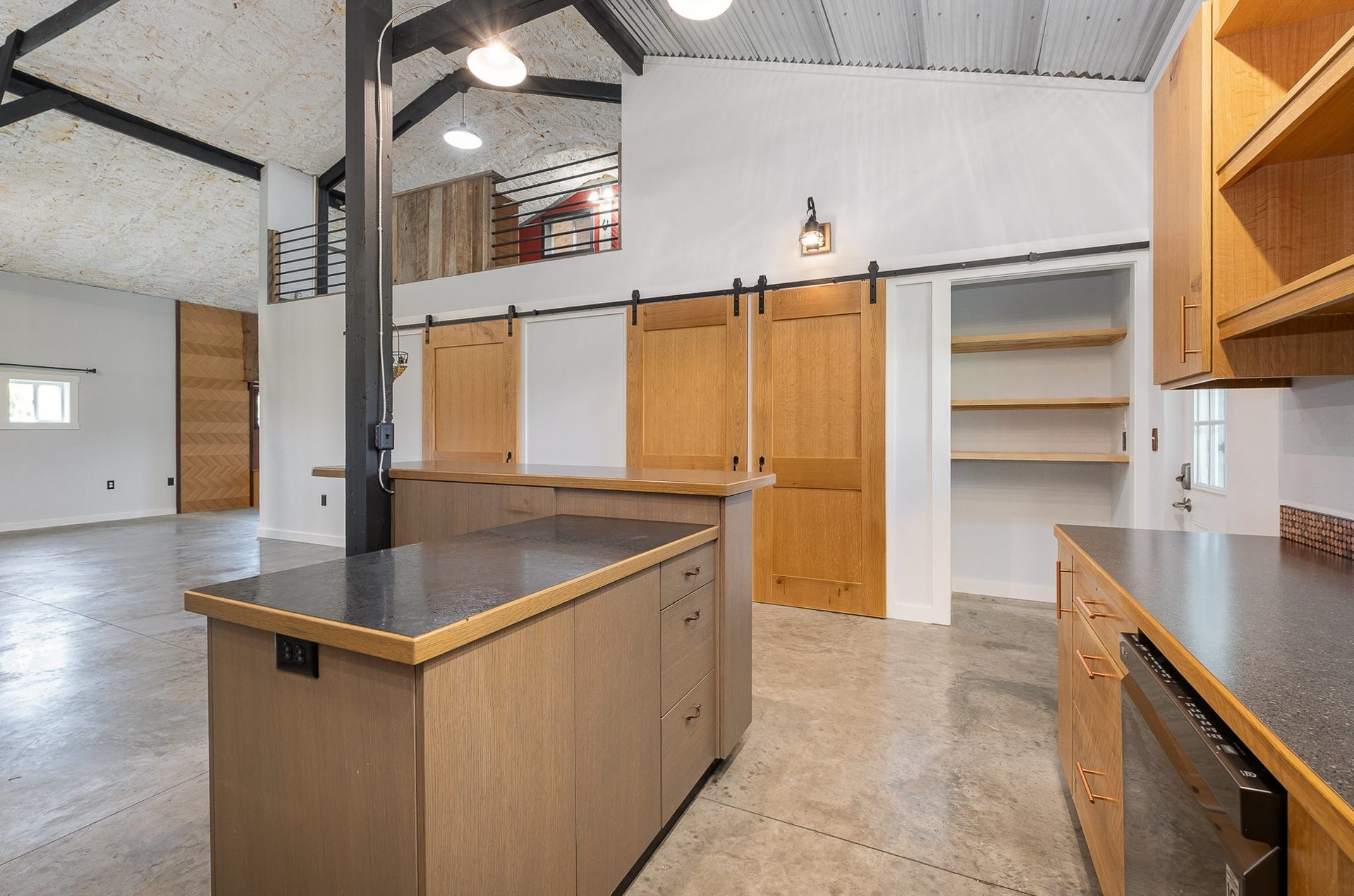 129 Highway 82 East, Bell Buckle, TN 37020 The kitchen island offers meal prep and serving options alike. Make note of the closet / pantry in this photo. Don't let the open floorplan fool you, this one has plenty of storage.