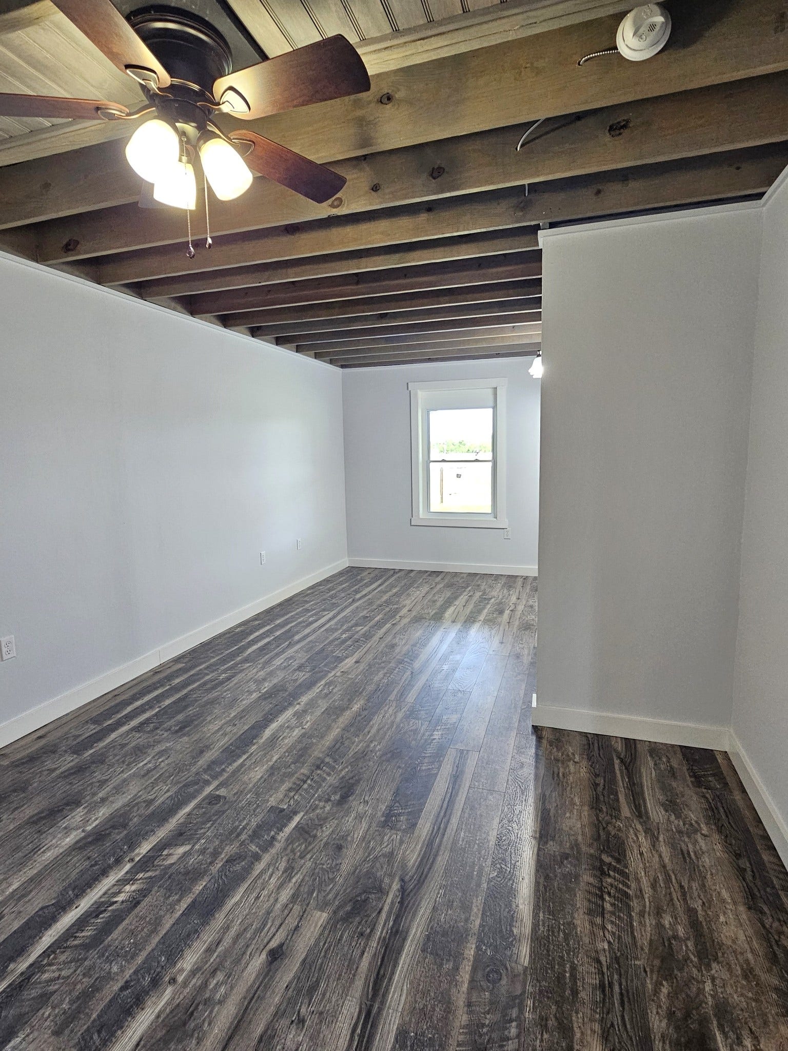 129 Highway 82 East, Bell Buckle, TN 37020 The bedroom in the home is large and has ceiling fan, room for a sitting area, a window to the rear of the property, and a large, well appointed walk-in closet.