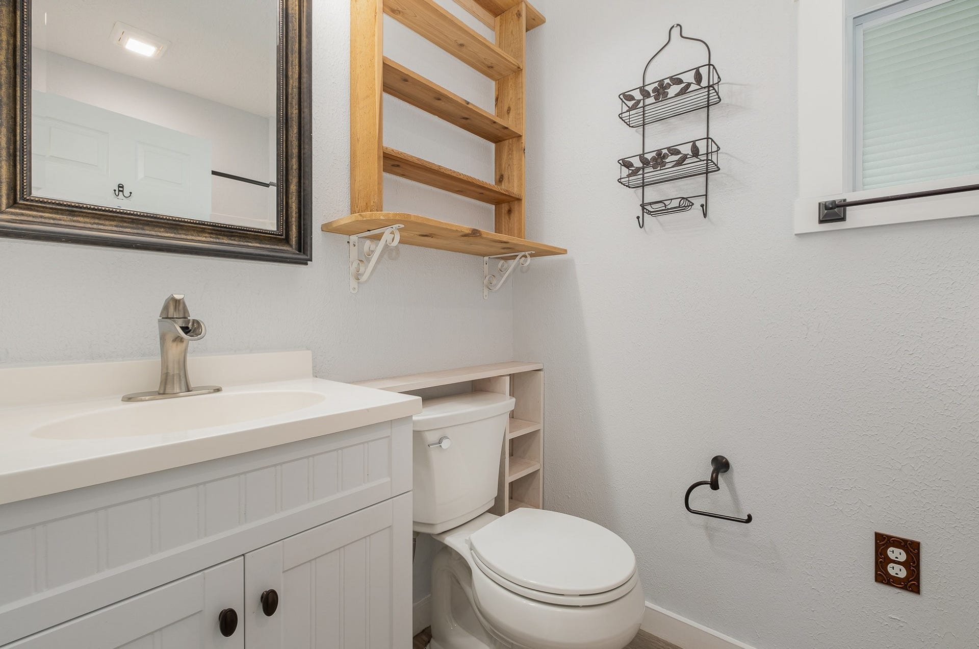 129 Highway 82 East, Bell Buckle, TN 37020 The home's bathroom offers a single vanity, stylish fixtures, and a shower / tub combo.