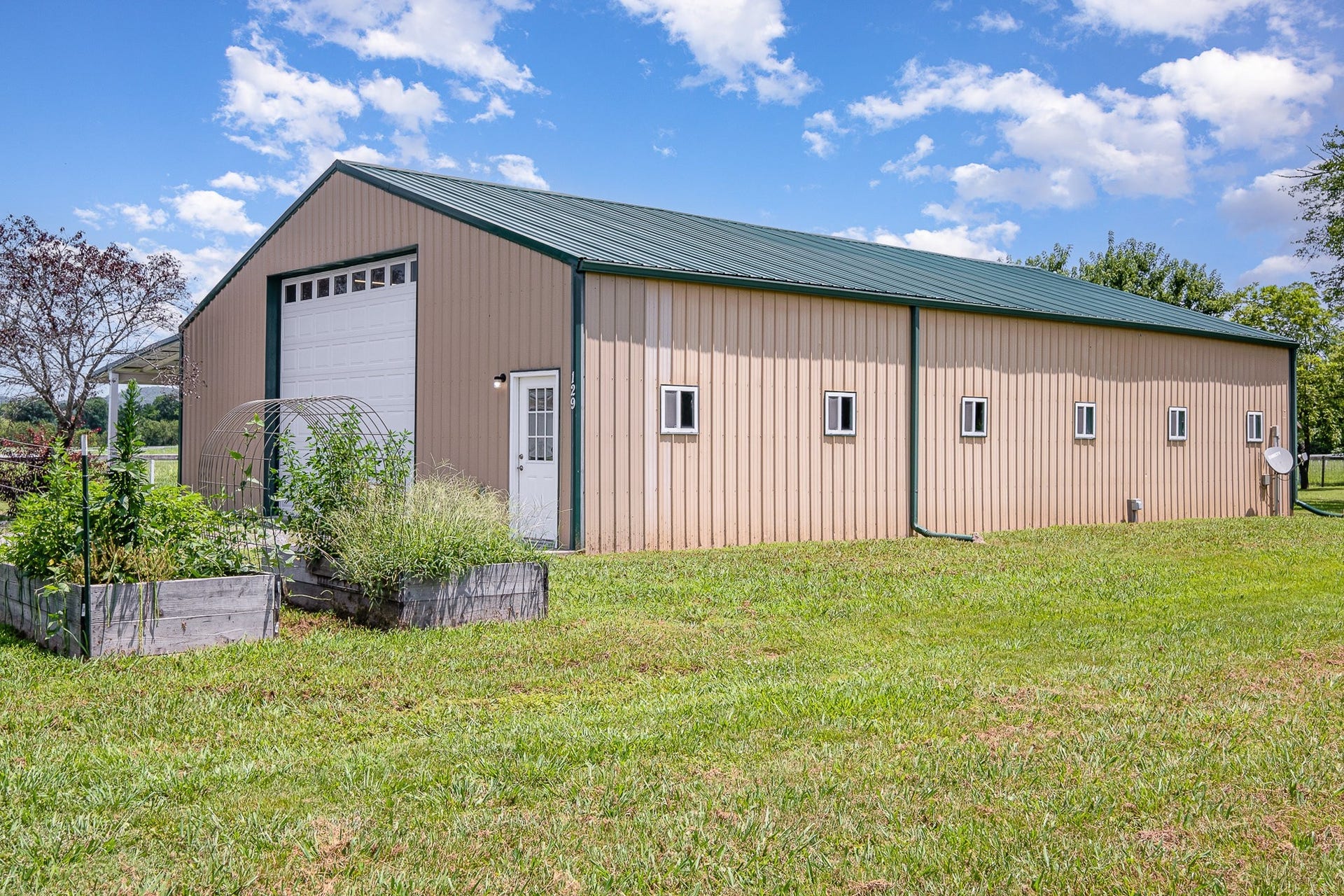 129 Highway 82 East, Bell Buckle, TN 37020 The new metal roof has a 40 year material / 5 year labor warranty and was installed in June of 2025. You won't need to worry about this one for a long time.