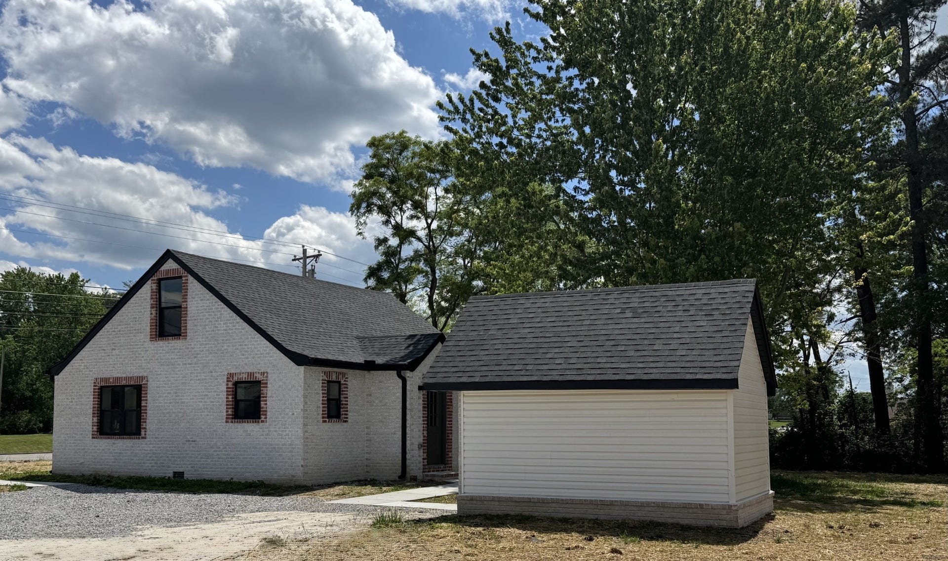 3313 McMinnville Hwy, Manchester, TN 37355 Rear view of home with large matching 14x10 Storage building.
