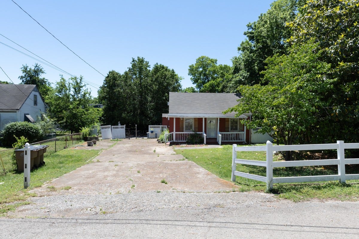 Large flat lot- Covered front porch - Extra wide driveway with plenty of parking spaces.