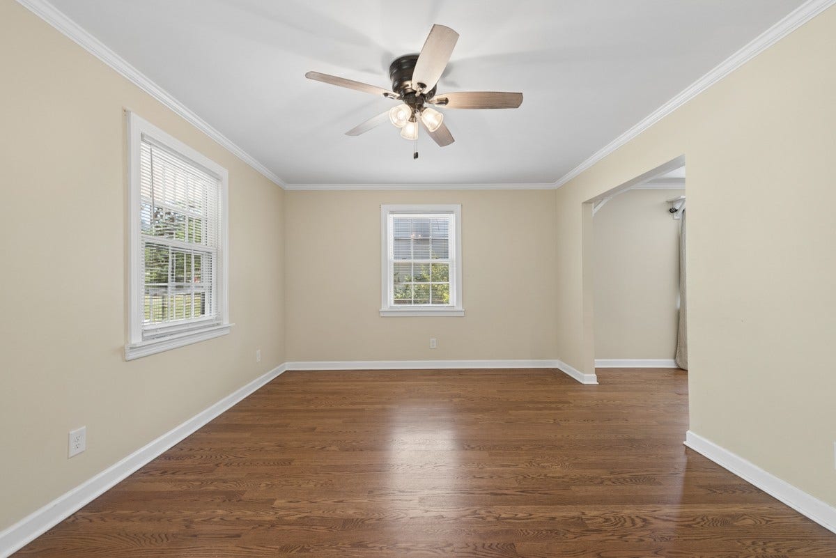 The living room flows seamlessly into dining room.