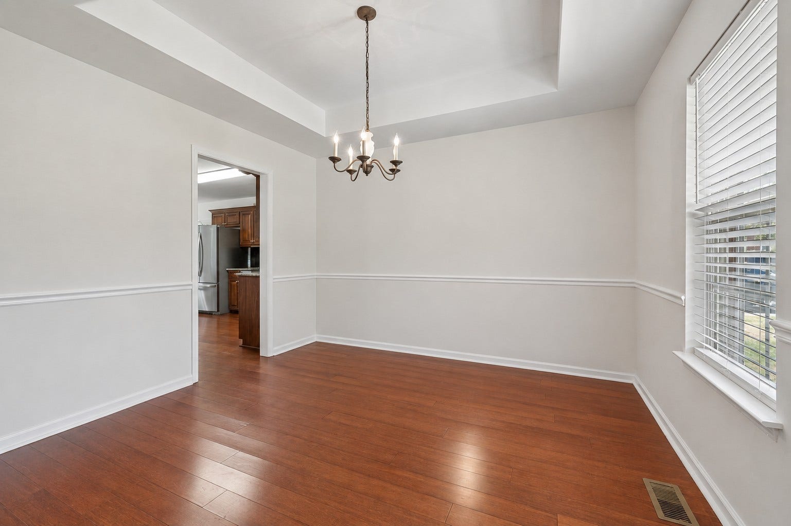 120 Callaway Ct, Murfreesboro, TN 37127 Formal dining room with trey ceiling, chandelier, and chair rail. 120 Callaway Court, Murfreesboro, TN 37127