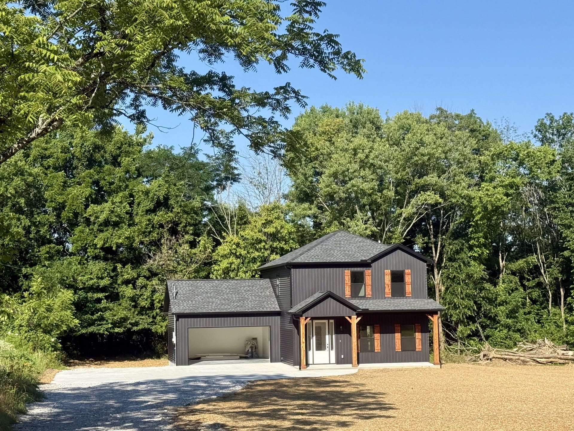 Beautiful home with 9 ft ceilings down, 3 bedrooms, 2.5 baths, custom cabinets, stainless steel appliances and .75 acres