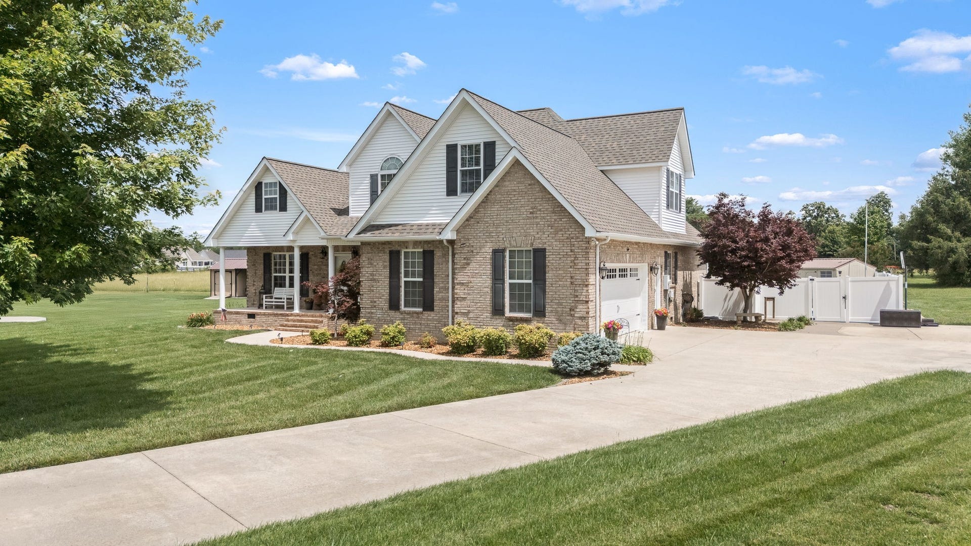 144 Richland Ct, Manchester, TN 37355 A charming sidewalk leads you to the concrete driveway, enhancing the home's curb appeal.