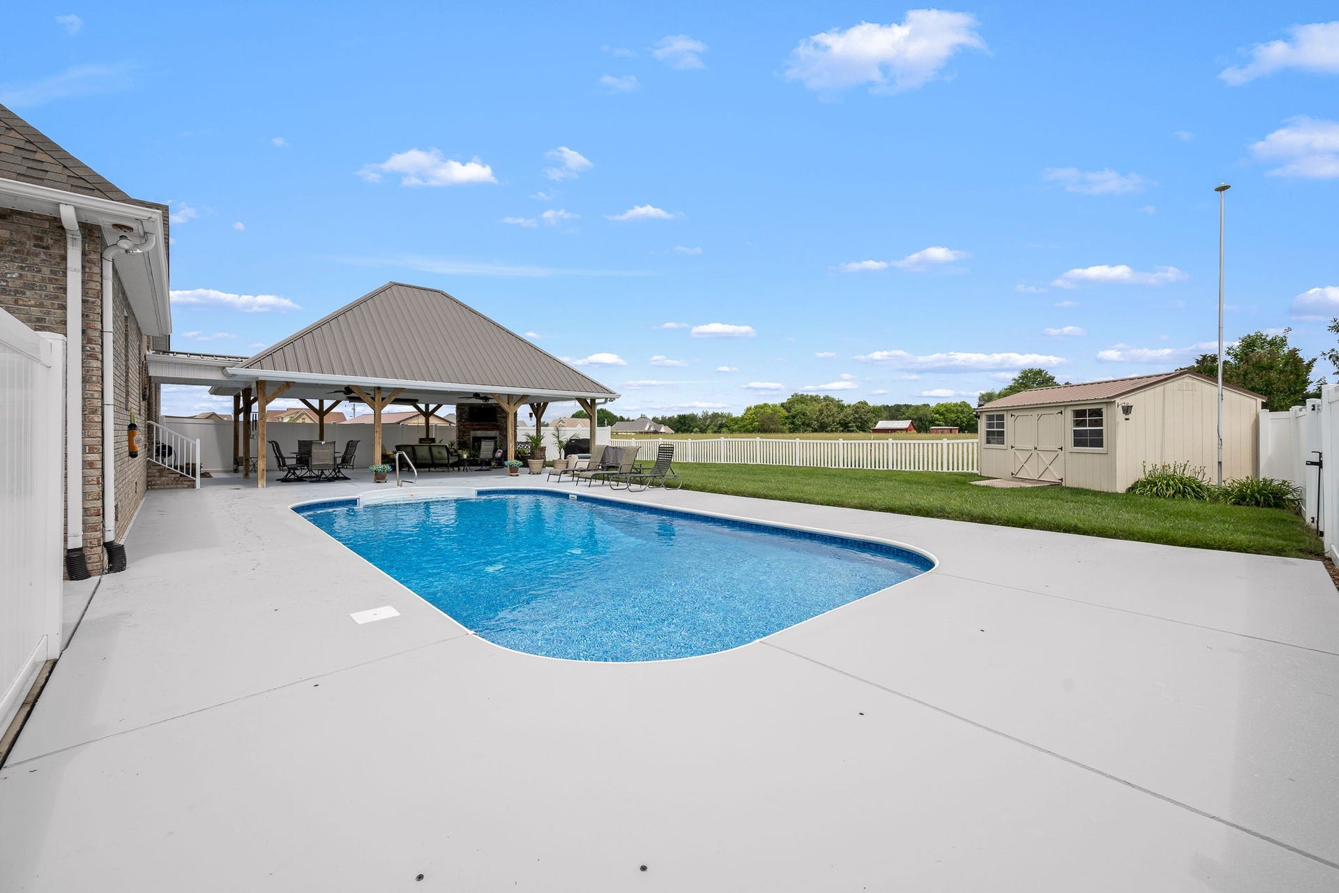 144 Richland Ct, Manchester, TN 37355 The spacious pool area is perfect for entertaining, soaking up the sun, or hosting summer barbecues.