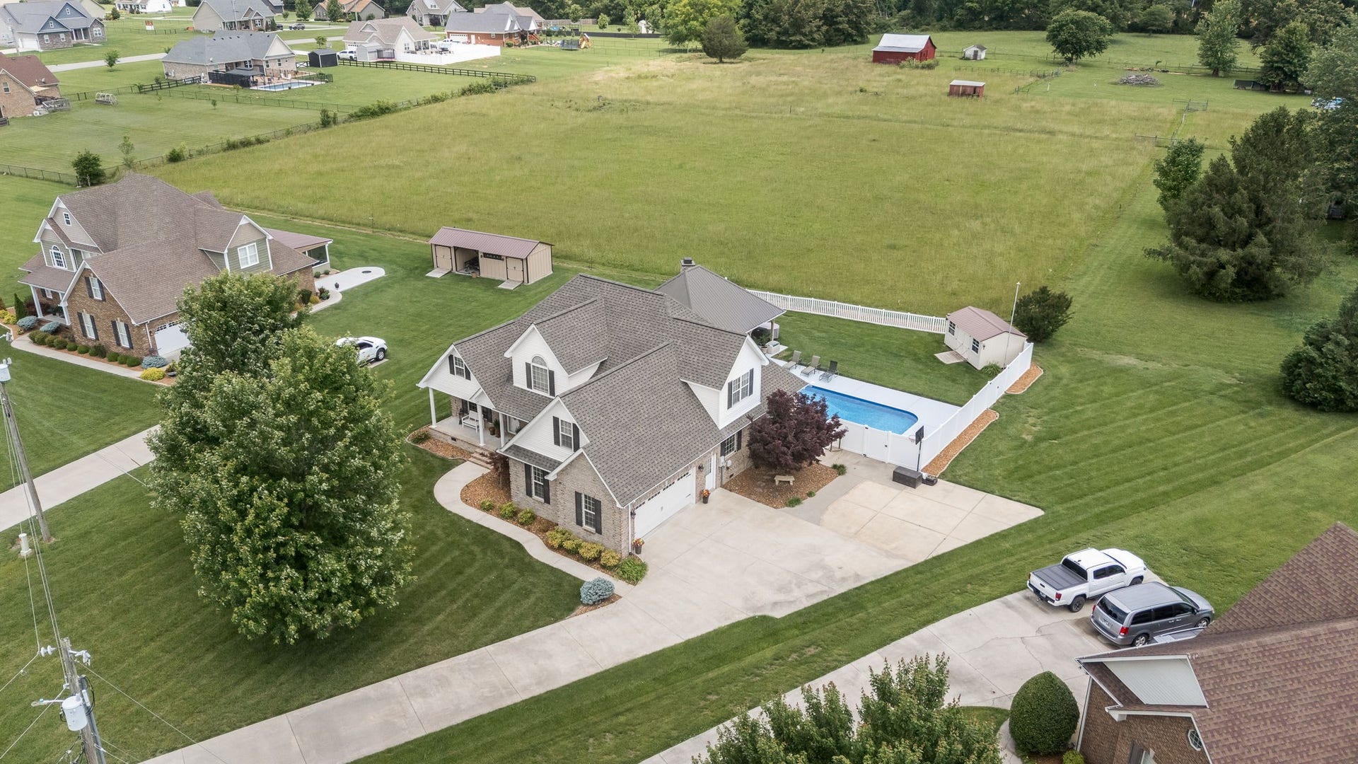 144 Richland Ct, Manchester, TN 37355 Discover this stunning custom brick home featuring a luxurious inground pool and a spacious pool pavilion with stone outdoor fireplace.