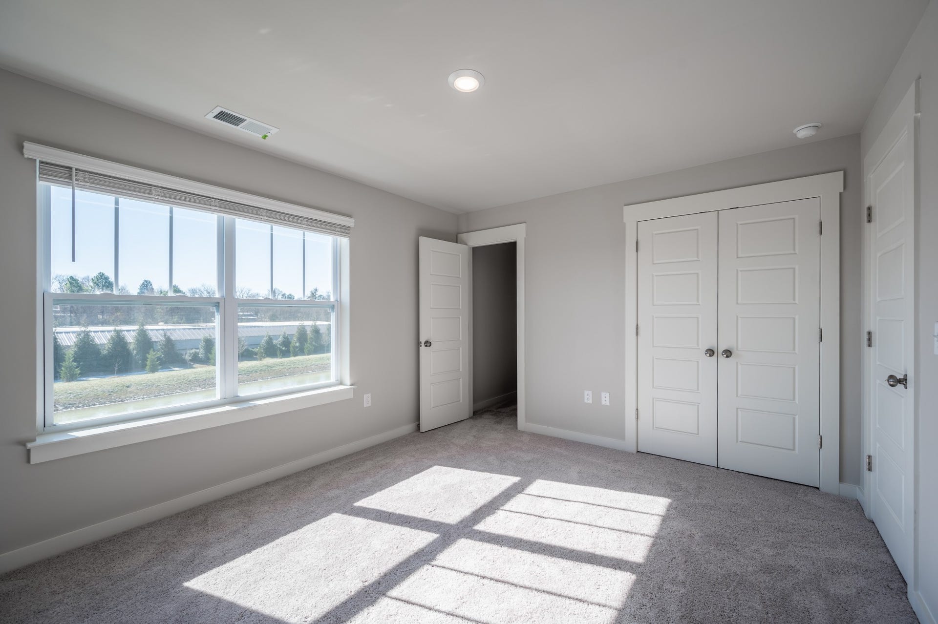 Primary bedroom with views of the water feature in back