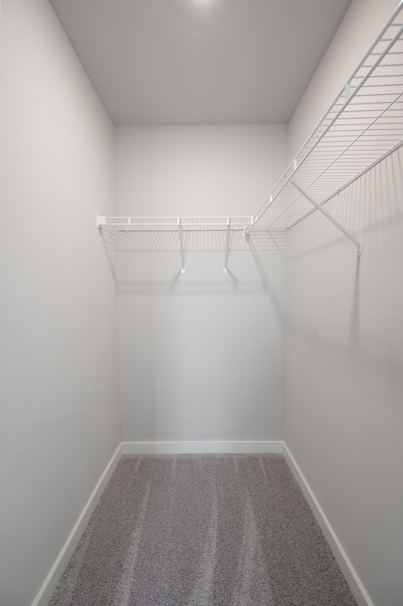 Walk-in closet in primary suite