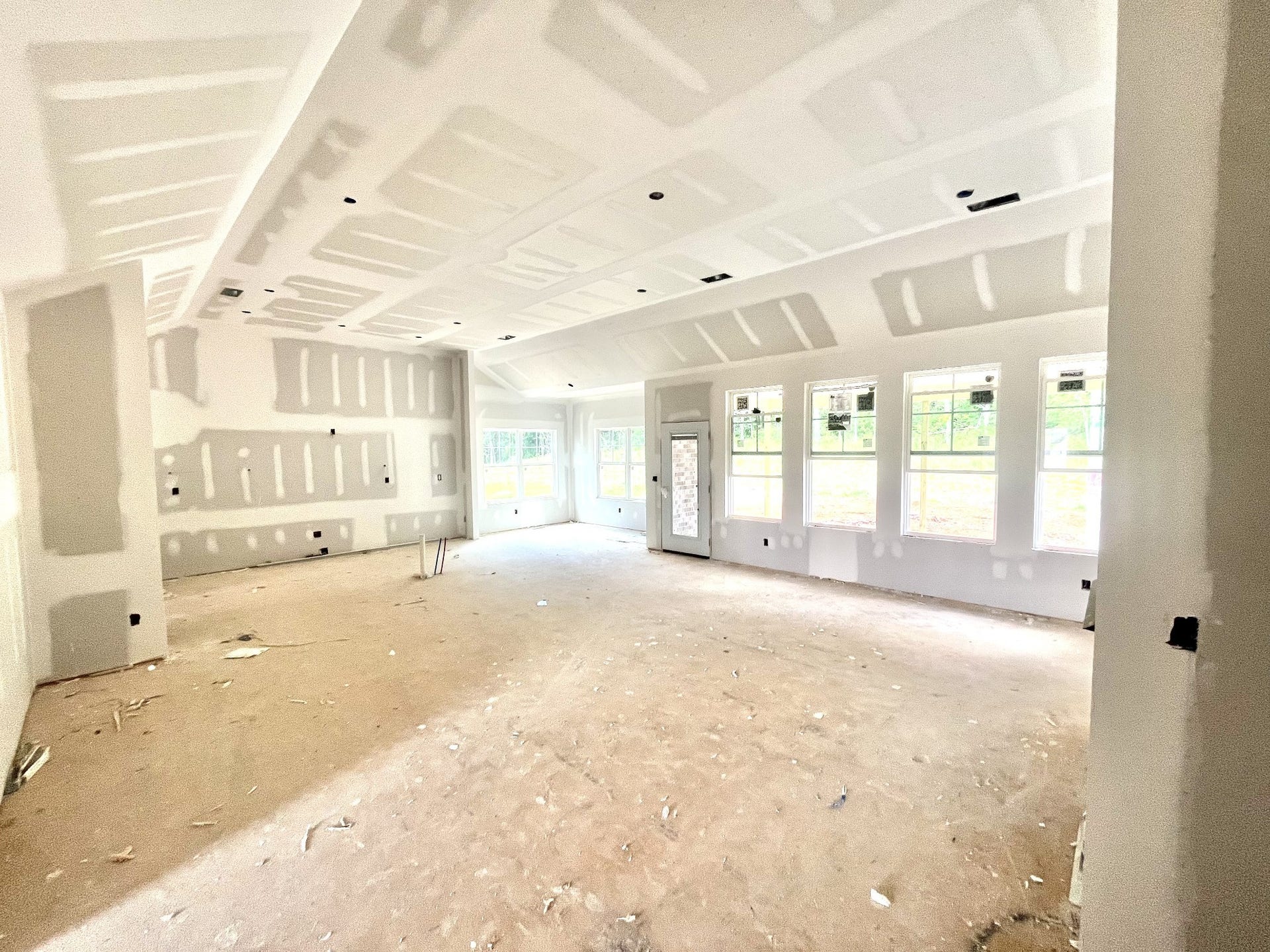 7208 Montana Road S, Murfreesboro, TN 37129 From the fireplace wall looking back at kitchen and dinning area. Kitchen will feature a large island