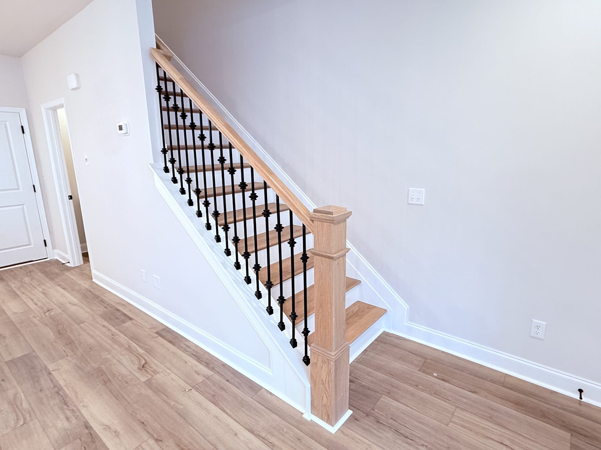 2718 Willowoak Trl, #2901, Murfreesboro, TN 37129 Hardwood stairs with iron spindles are included, offering a sophisticated design feature that elevates the homes overall aesthetic.