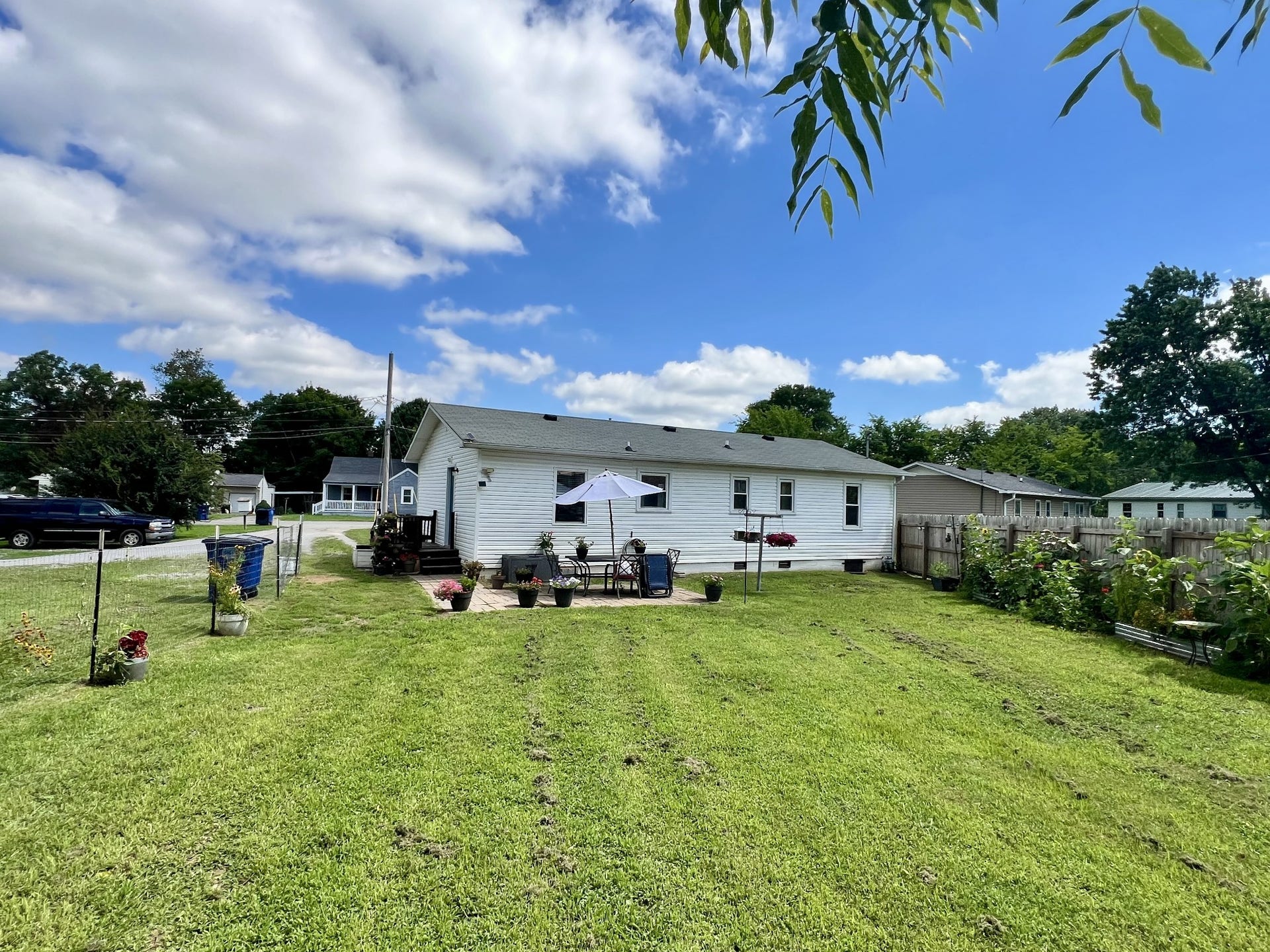 618 Coble Cir, Shelbyville, TN 37160 This is a view of the back of the house with a patio.