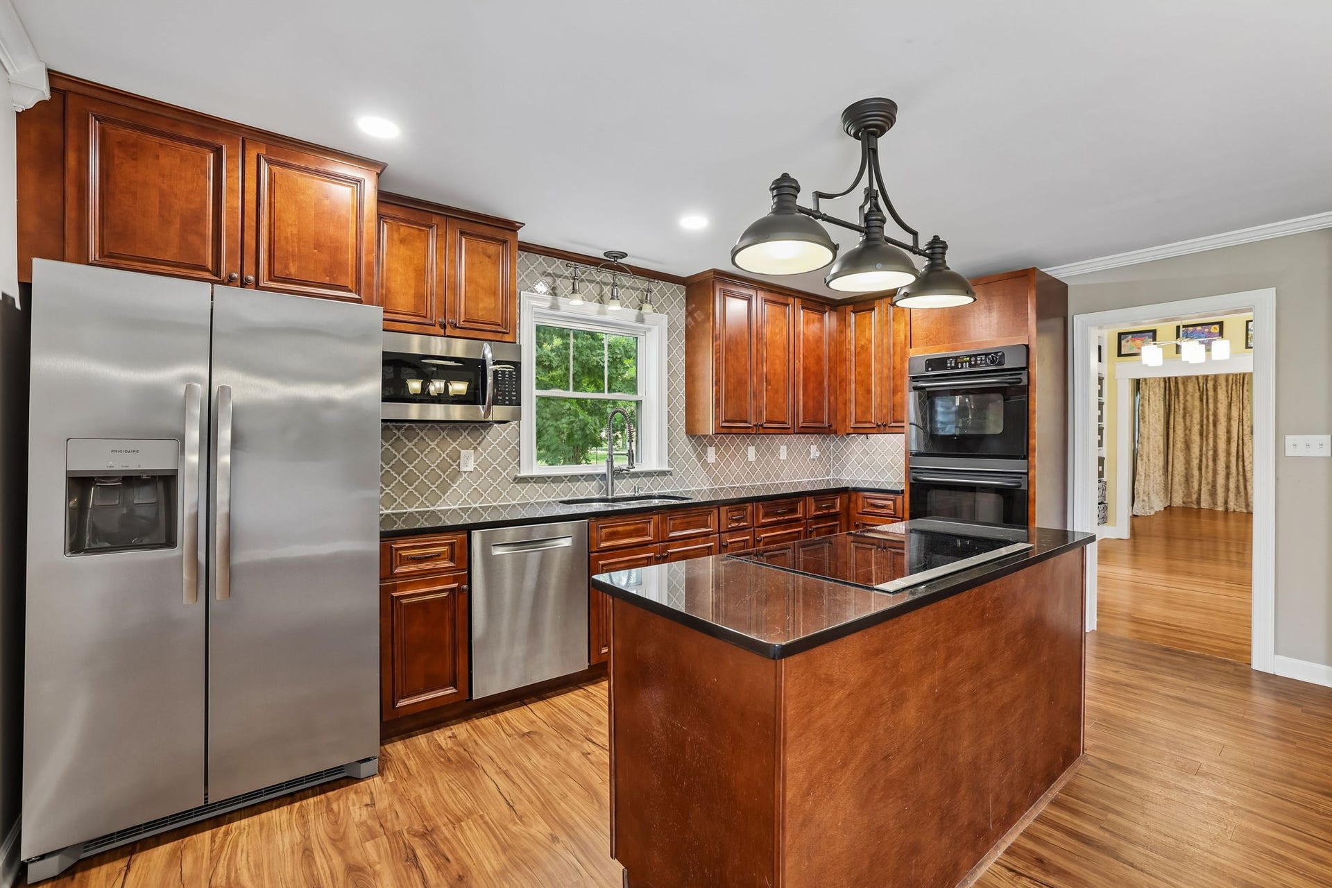 186 Sulphur Springs Rd, Shelbyville, TN 37160 Stainless steel side by side fridge, dishwasher, microwave along with a cooktop stove with pop up exhaust fan on the island! 186 Sulphur Springs Rd, Shelbyville, TN 37160
