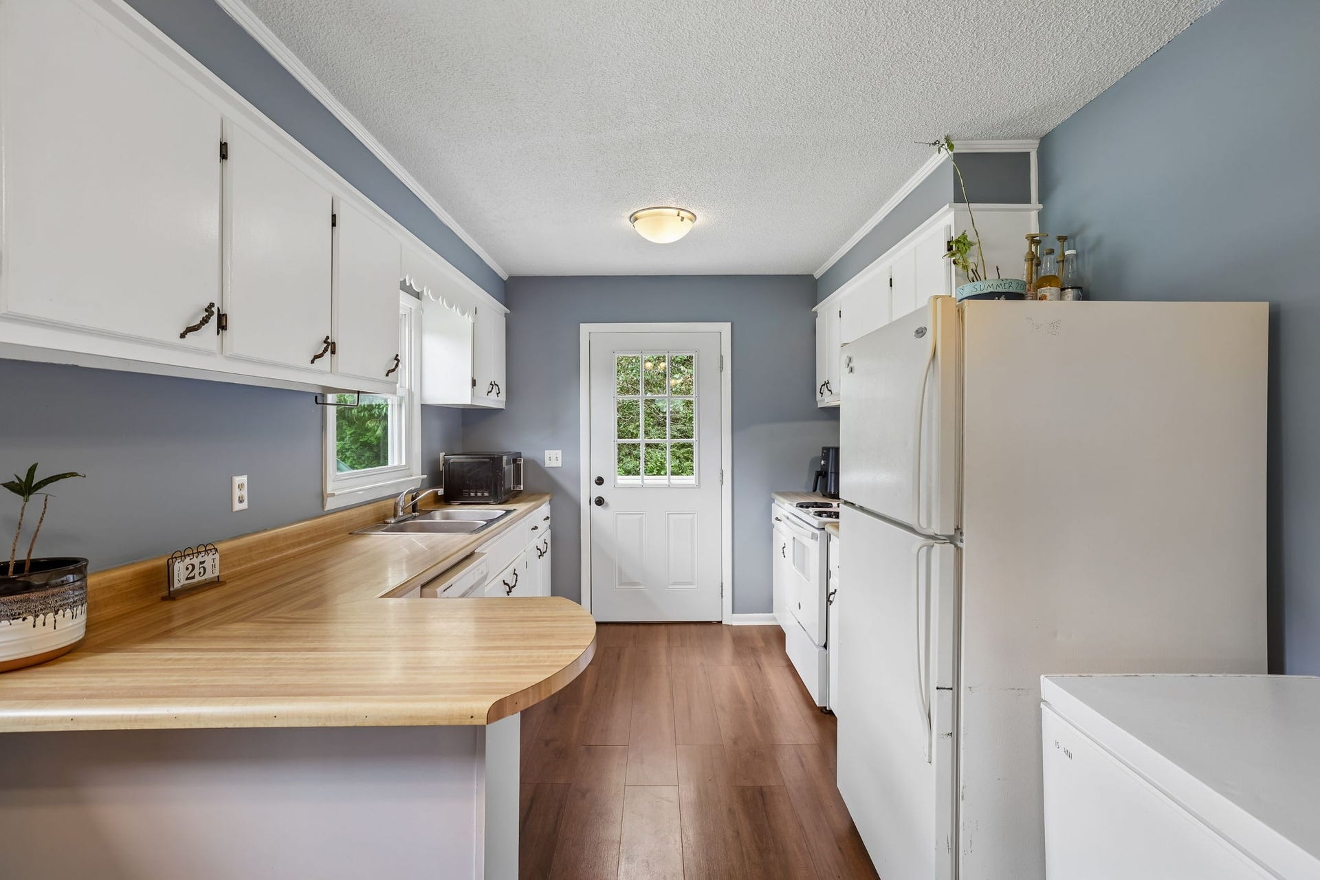 2420 Hawkersmith Rd, Manchester, TN 37355 Highly functional kitchen features timeless white cabinetry with butcher block look countertops! 2420 Hawkersmith Rd, Manchester, TN 37355