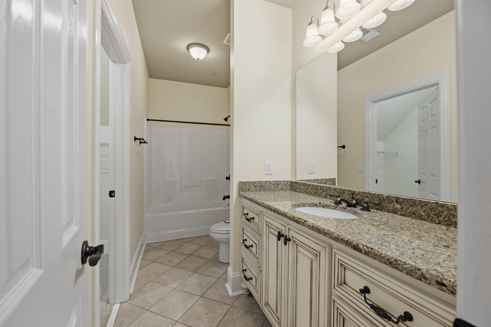 2926 Frank Robinson Dr, Murfreesboro, TN 37130 Full bath in bedroom with walk-in closet to the left that is attached to a private media room