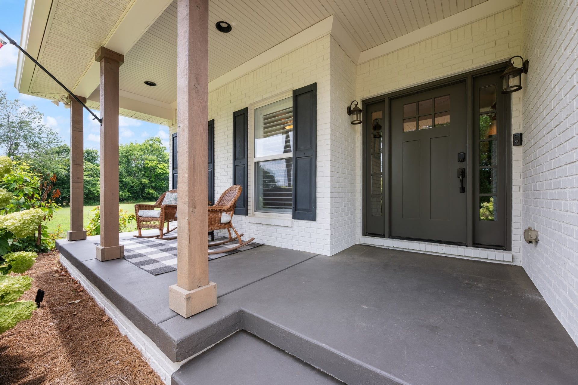 2711 Ernest Hawkins Rd, Columbia, TN 38401 Front Porch with outdoor lighting added and freshly manicured landscaping.