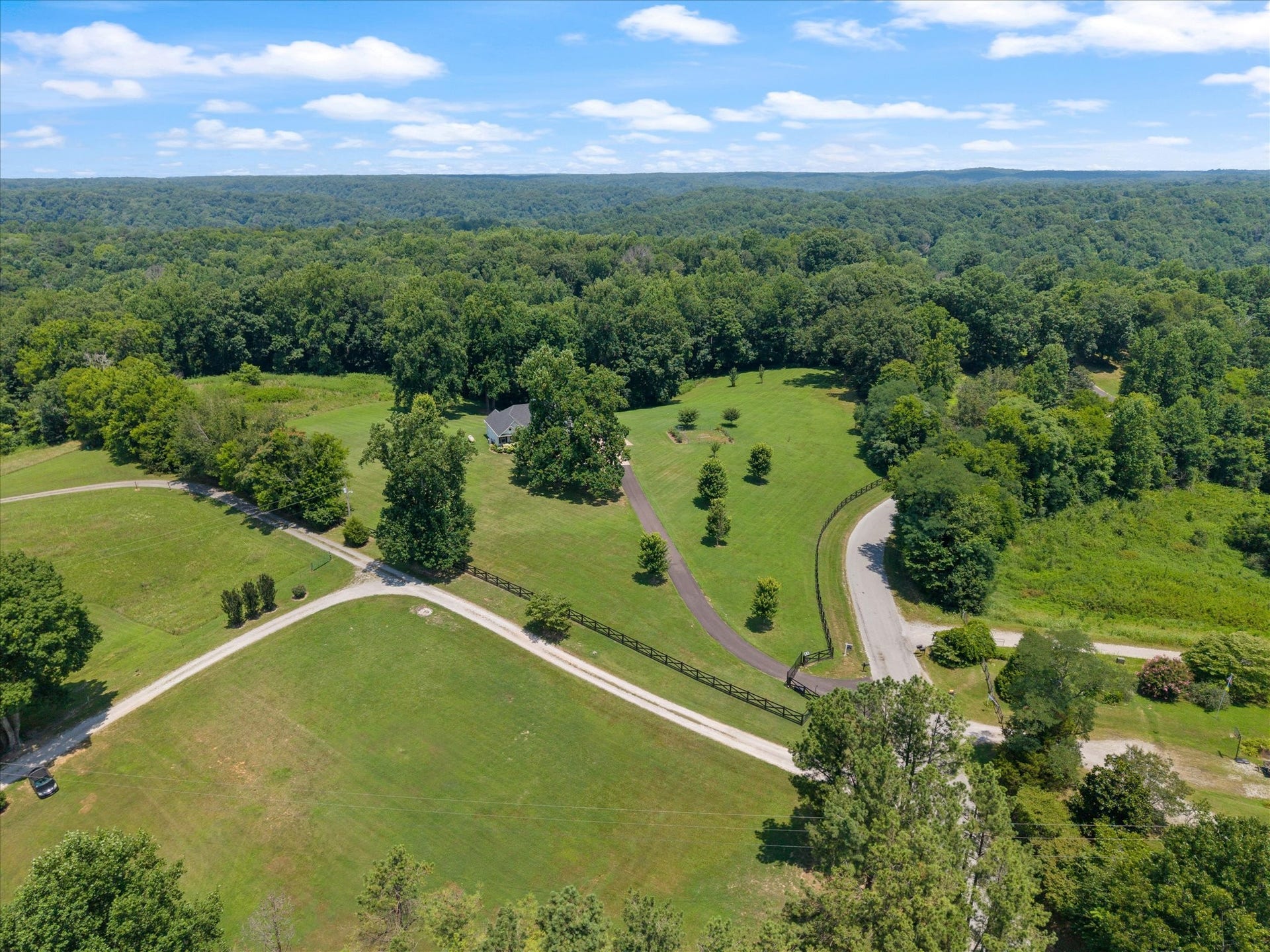 2711 Ernest Hawkins Rd, Columbia, TN 38401 Seller added fencing and motorized gate with keypad.