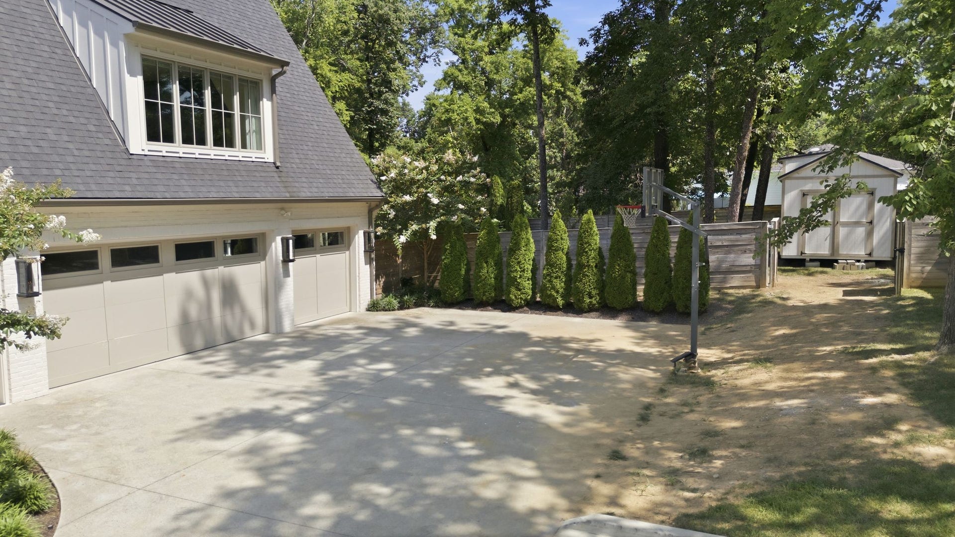 508 Davidson Road, Nashville, TN 37205 Last but not least, the three car oversized garage offers plenty of storage. The area to the right of the basketball hoop allows a view of the side yard with the storage building in the backyard.