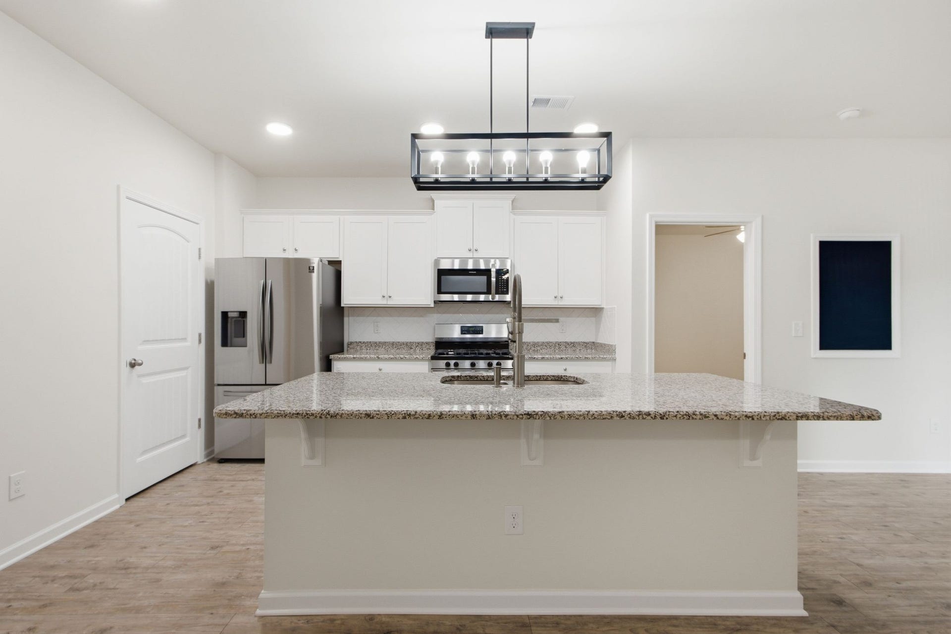 716 Prominence Rd, Columbia, TN 38401 Kitchen with an Island, Granite Counters, Tile Backsplash, a Pantry and Stainless Steel Appliances (Refrigerator will Remain)