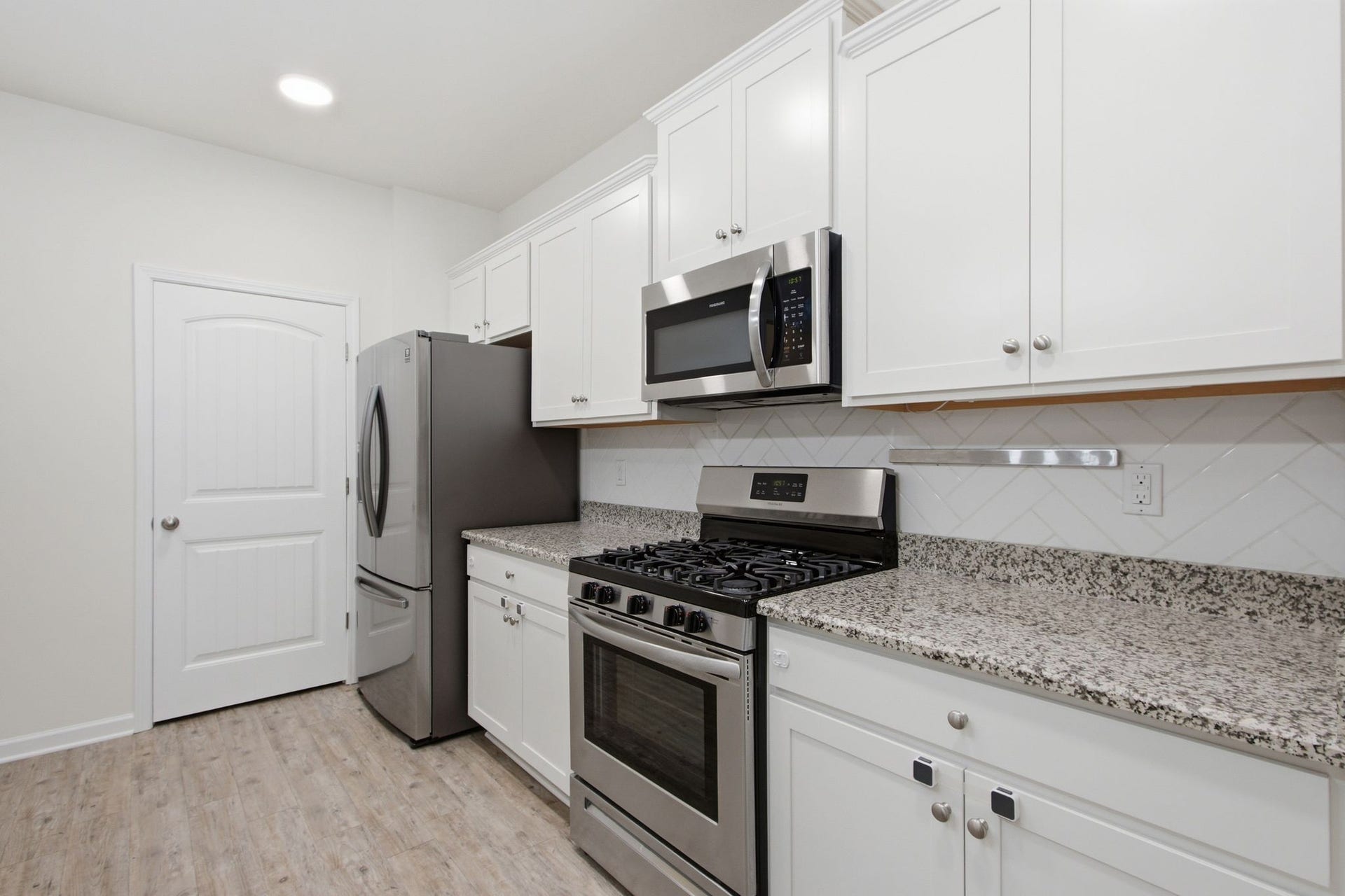 716 Prominence Rd, Columbia, TN 38401 Granite Counters, Tile Backsplash, Stainless Steel Appliances, Built-In Microwave, New Dishwasher, Gas Stove and a Pantry