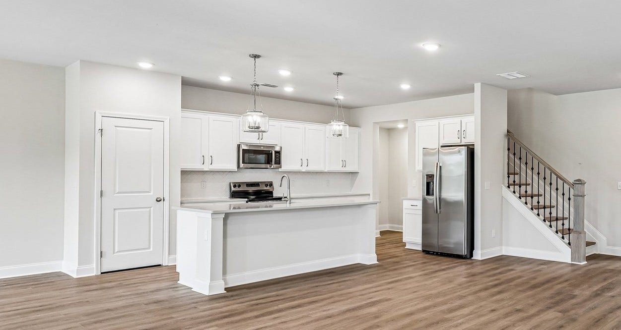 2705 Wilkinson Pike, #2, Murfreesboro, TN 37129 This home is complete with brushed nickel finishes and stylish pendant lighting -- thoughtfully selected to enhance the kitchen's modern design and functionality.