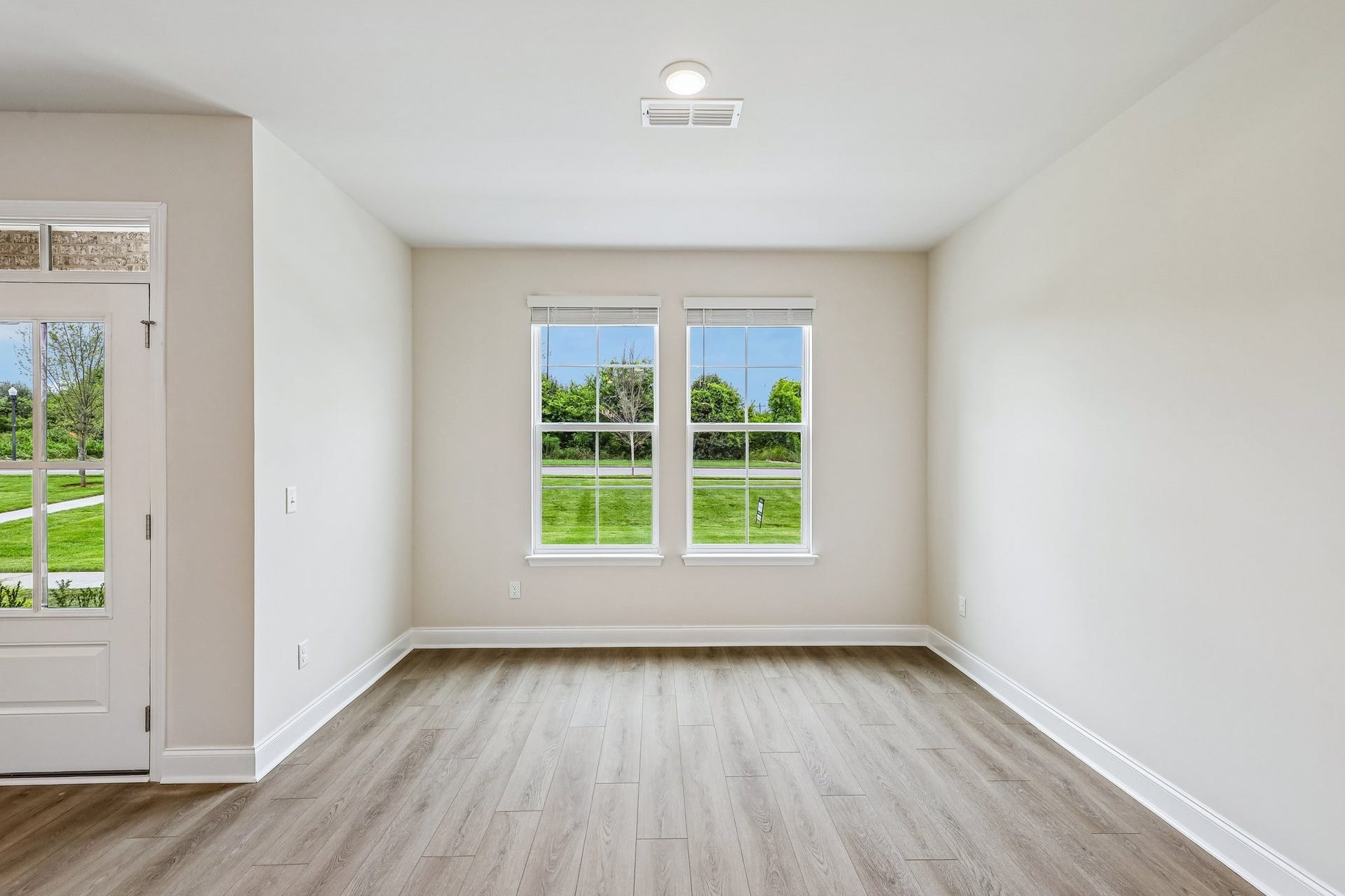2705 Wilkinson Pike, #2, Murfreesboro, TN 37129 Located at the front of the home, the dining room features large windows, filling the room with natural light and offering a peaceful view.