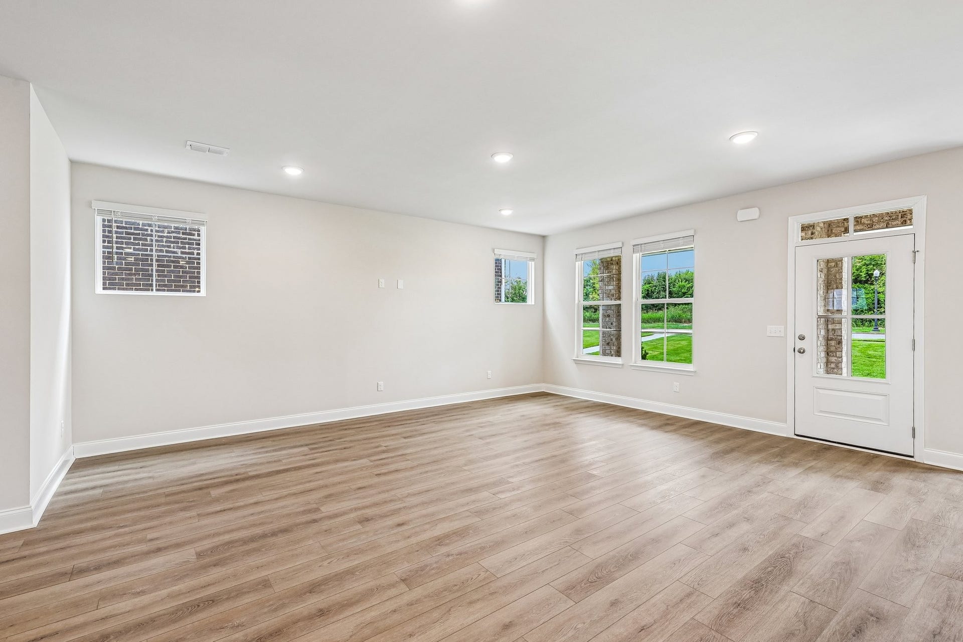 2705 Wilkinson Pike, #2, Murfreesboro, TN 37129 The great room is designed to accommodate both everyday living and large gatherings. Abundant natural light streams through large windows, creating a bright and inviting atmosphere.