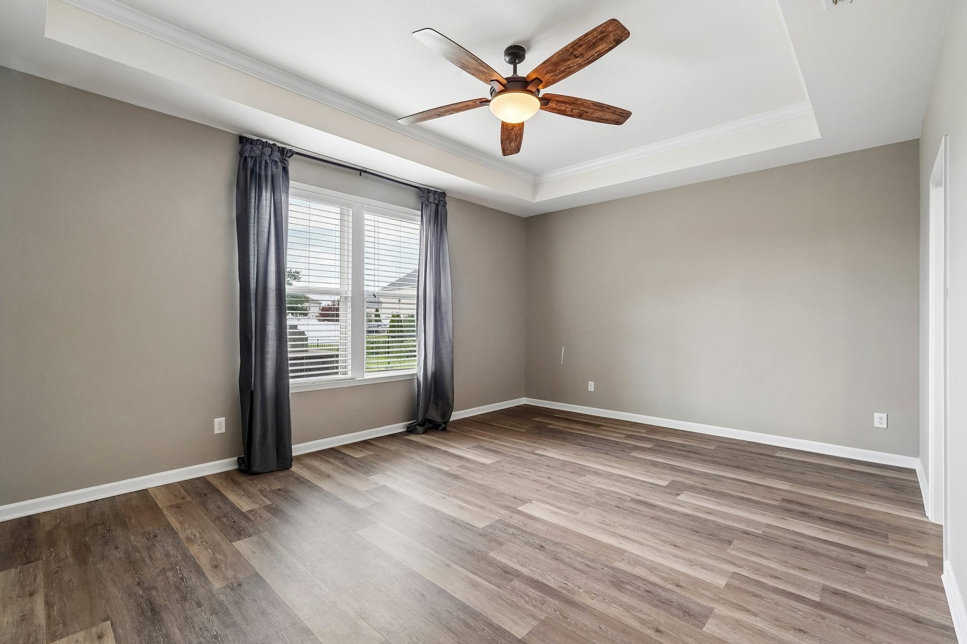 3438 Hyde Ct, Murfreesboro, TN 37128 Primary bedroom with wood flooring and double windows