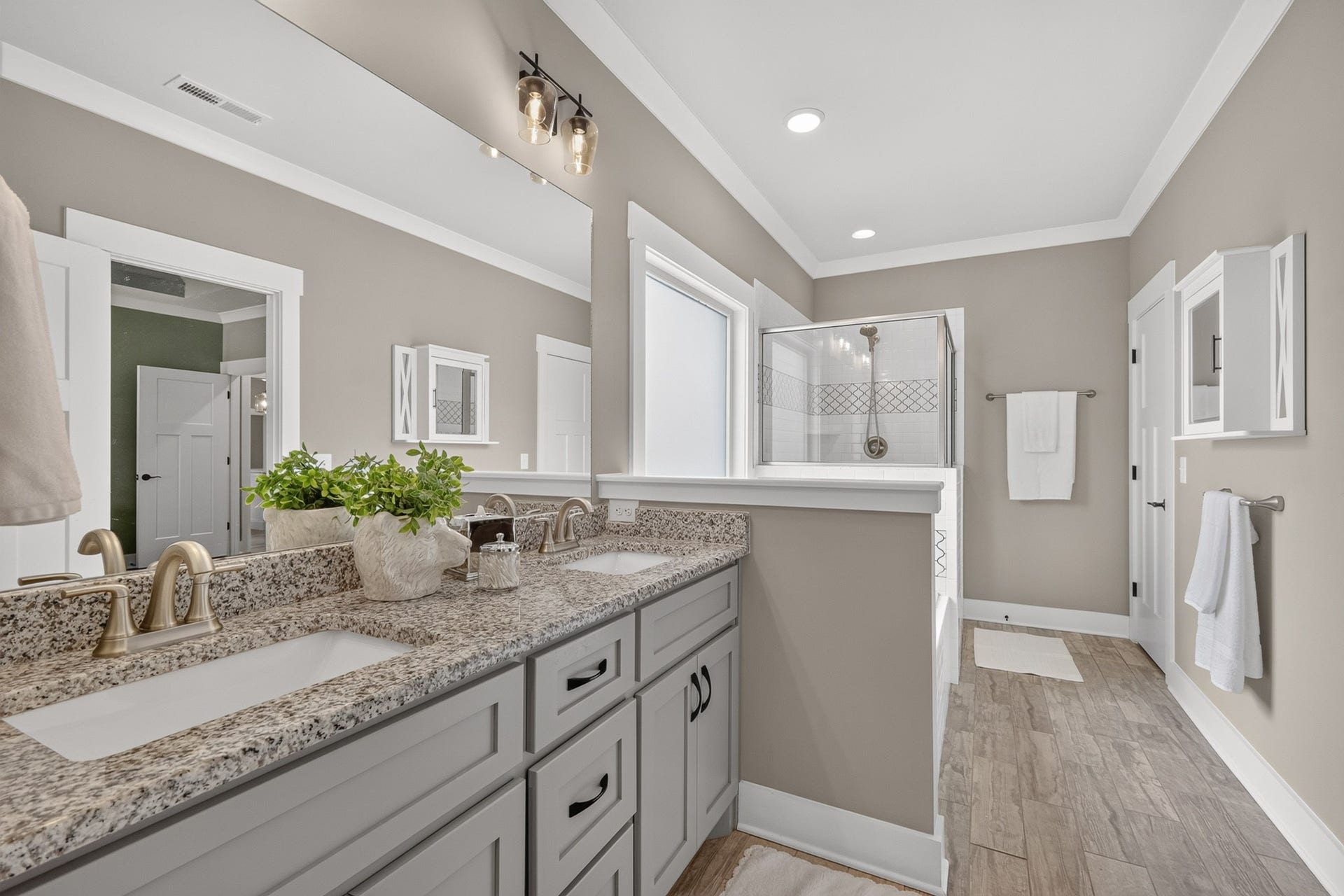 197 Bluegrass Rd, Manchester, TN 37355 Primary bath located on main floor features double sink, tile, and granite