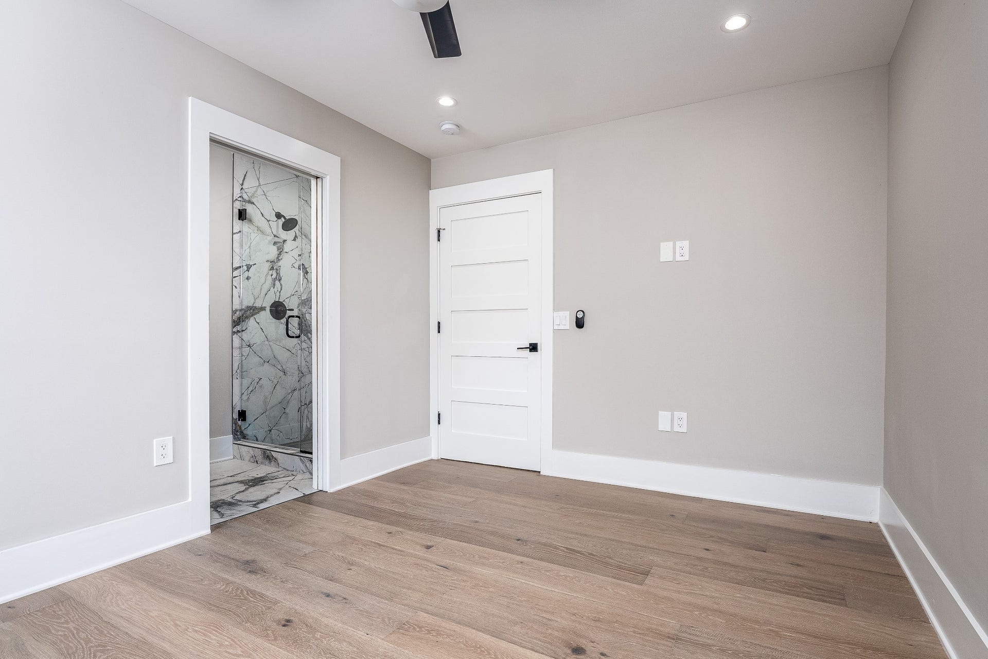 428 E Trinity Ln, #B, Nashville, TN 37207 First floor Bedroom with view to the Ensuite Bathroom w/tile shower surround.