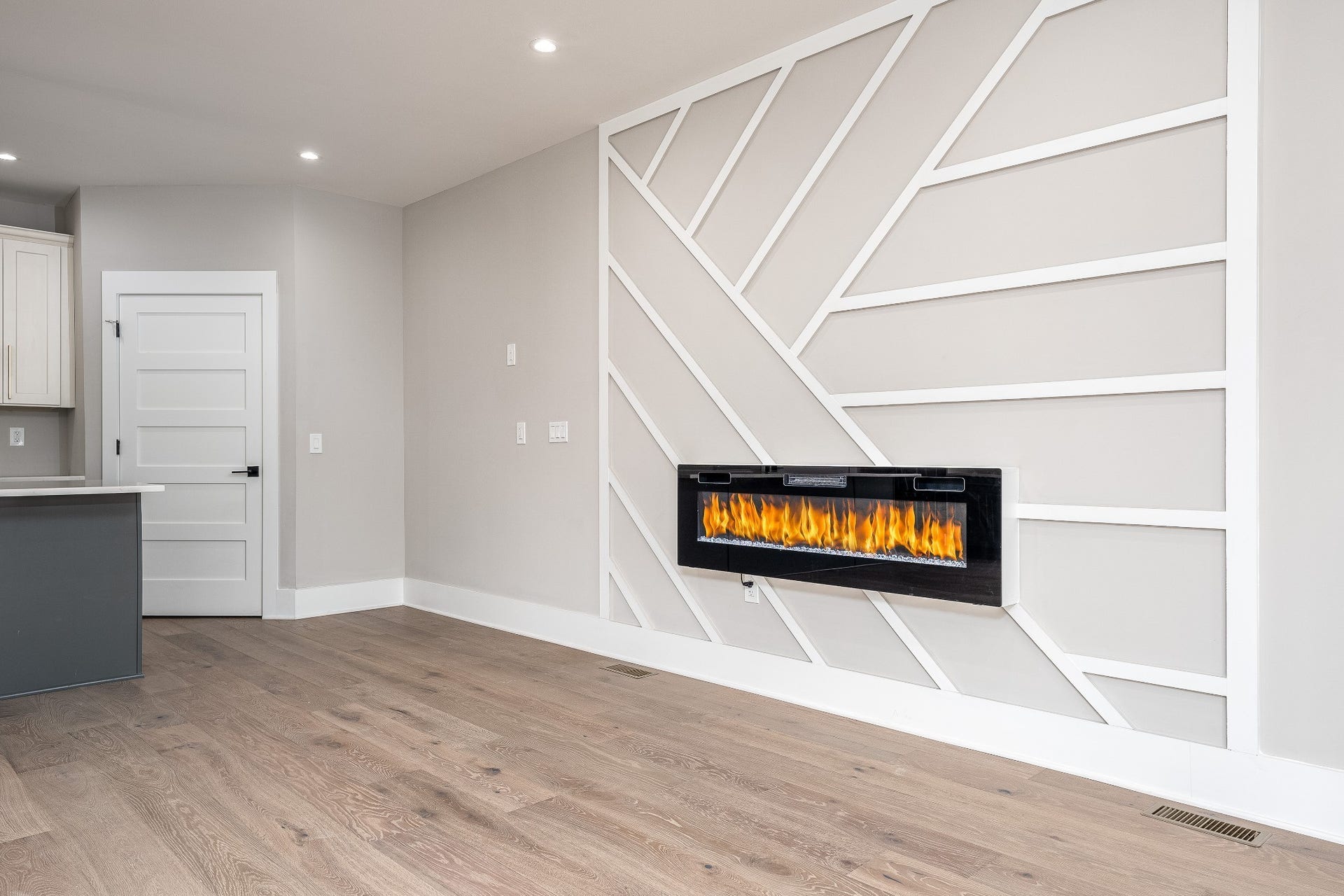 428 E Trinity Ln, #B, Nashville, TN 37207 Enjoy the Living Room view of the electric fireplace, featuring crystal accents and customizable light settings to create the perfect ambiance for you and your guests.