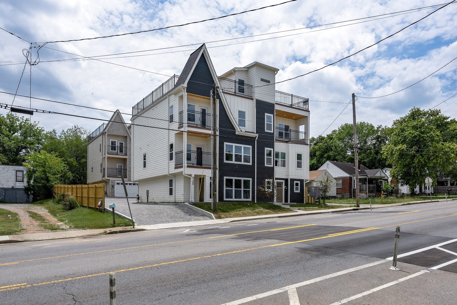 428 E Trinity Ln, #B, Nashville, TN 37207 Exterior Photo. Shows shared driveway that leads to each unit's 2 Car Garages. Also includes 4 additional parking pads one surface space per Unit ideal for Guests.